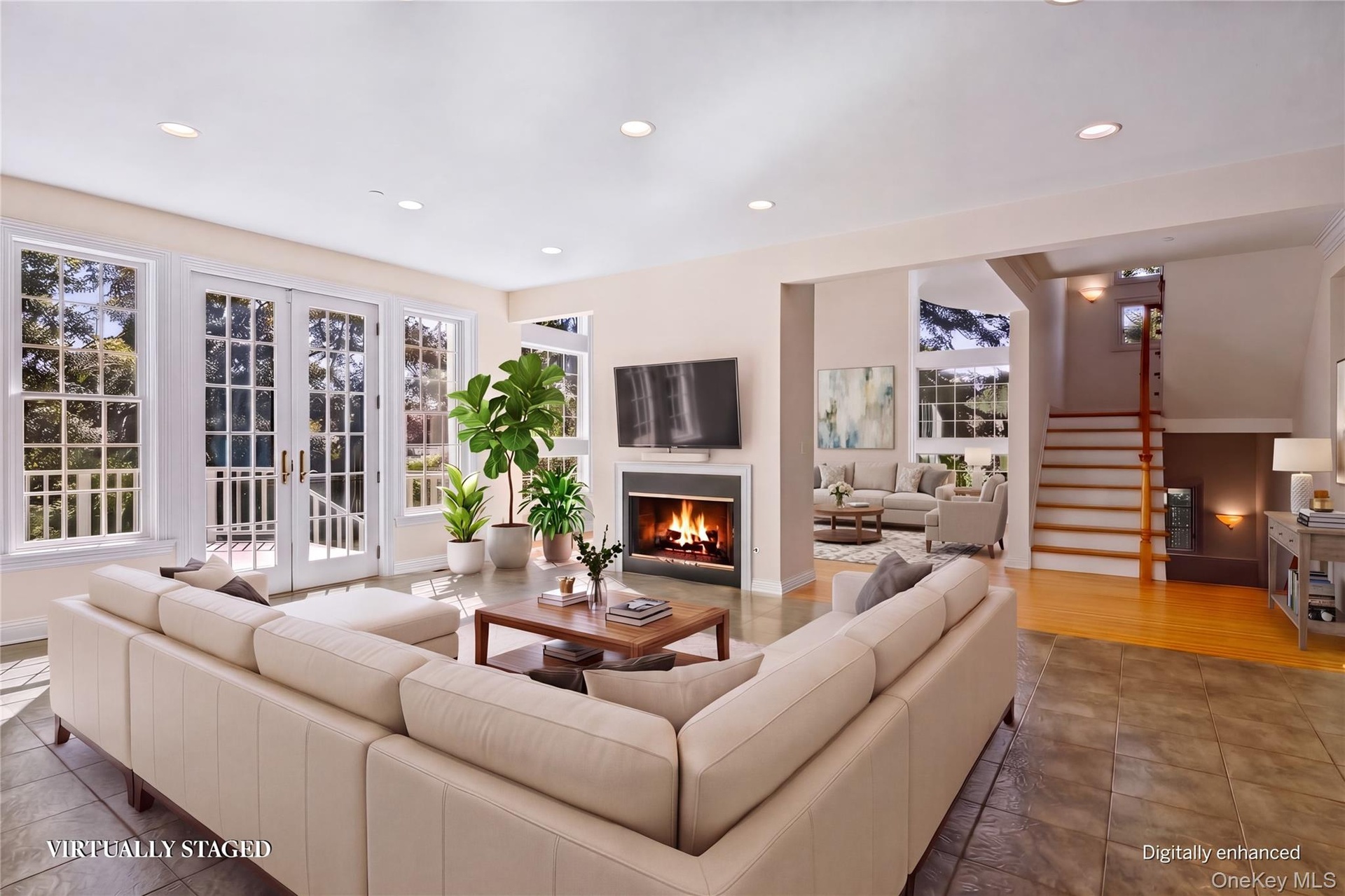 Virtual staging. Two sided Gas fire place, French doors to deck.