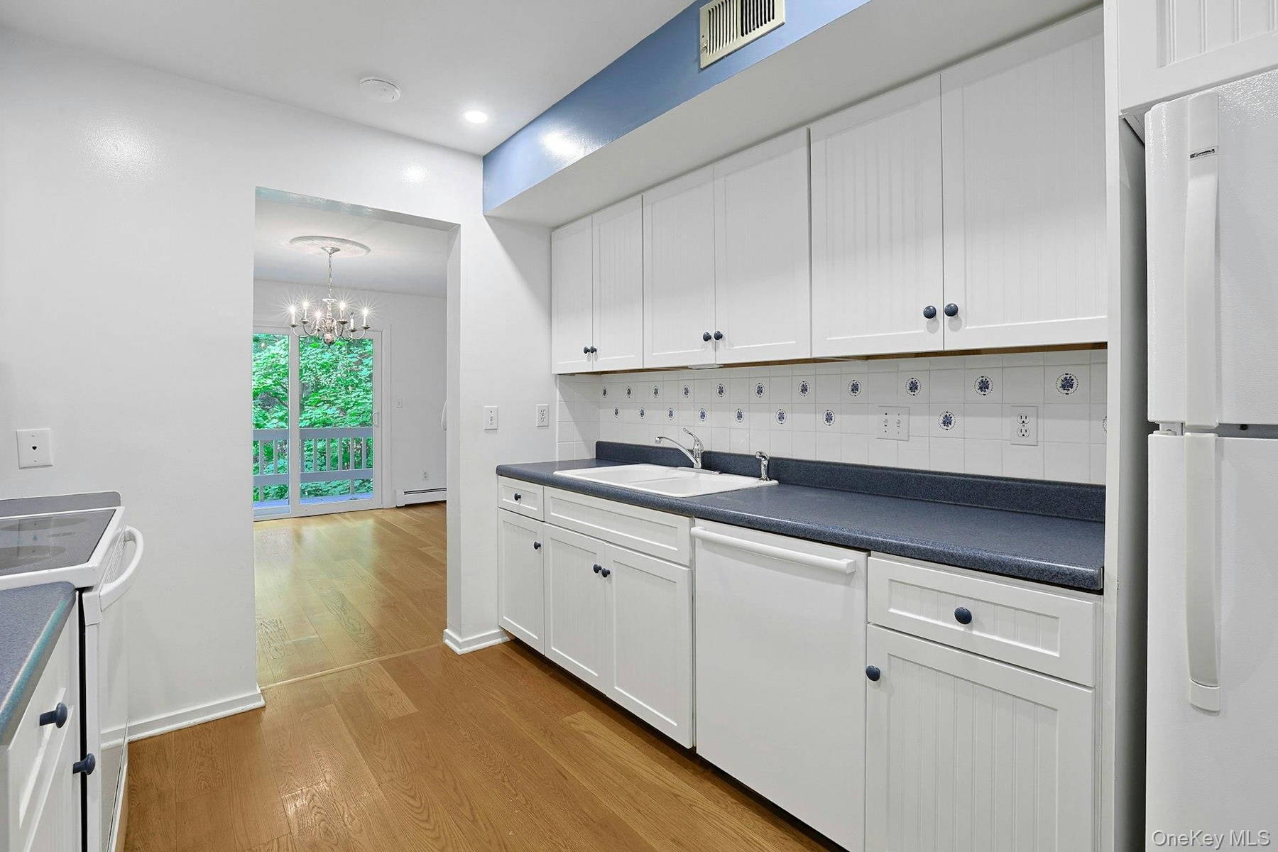 The vinyl floor in the kitchen is comfortable underfoot and easy to clean.