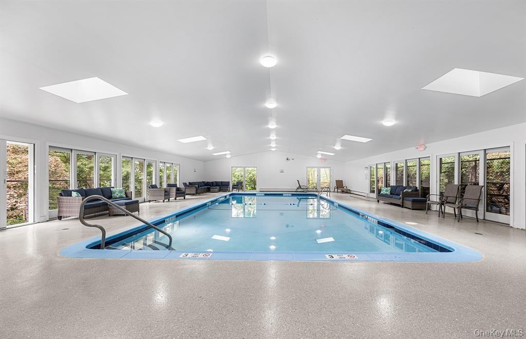 The large indoor community pool is protected from weather. Just a few steps from the home, this is an amazing amenity - literally in your backyard!