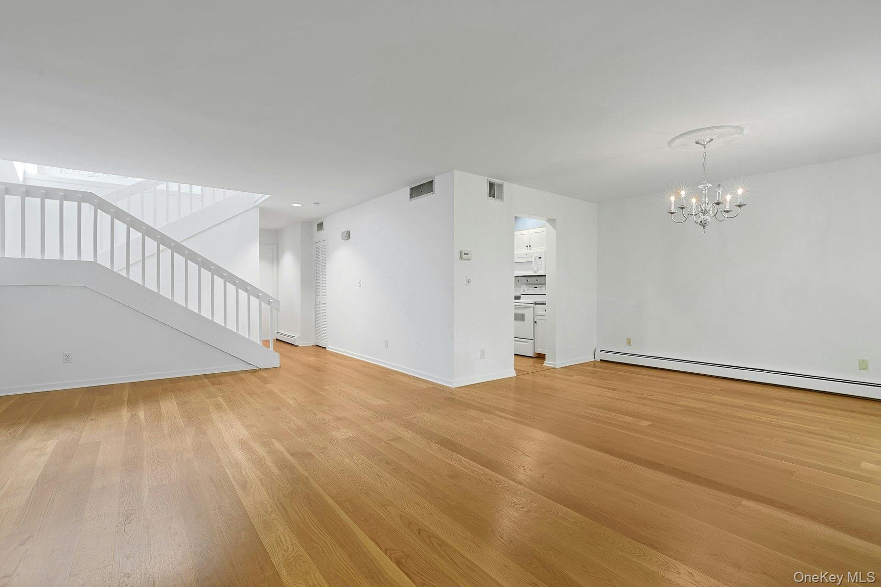 The living room and dining room flow together, making entertaining and meal time so much easier and pleasant. The kitchen is also easily accessible of