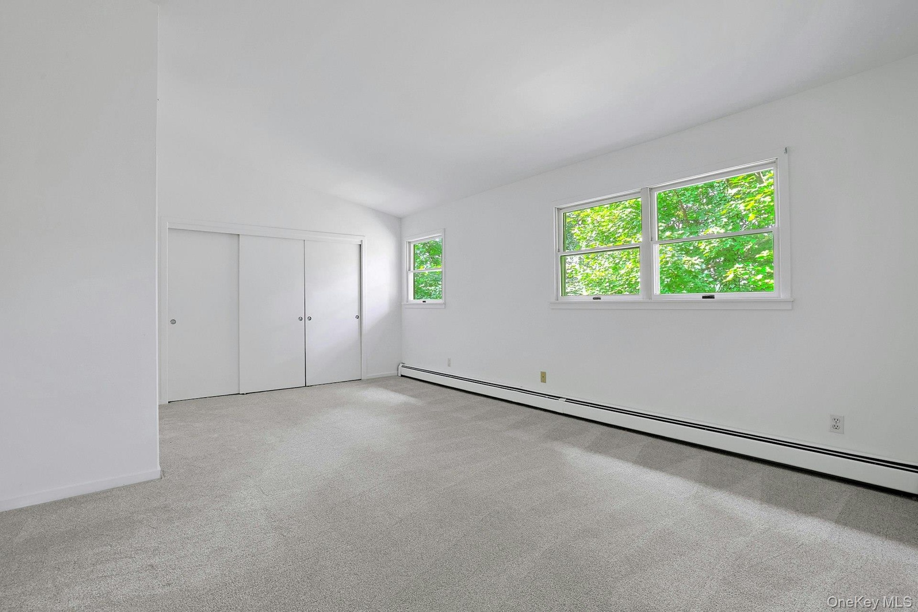 The primary bedroom retreat is large and deep, running the whole width of the home. High ceilings here as well bring a sense of peace.