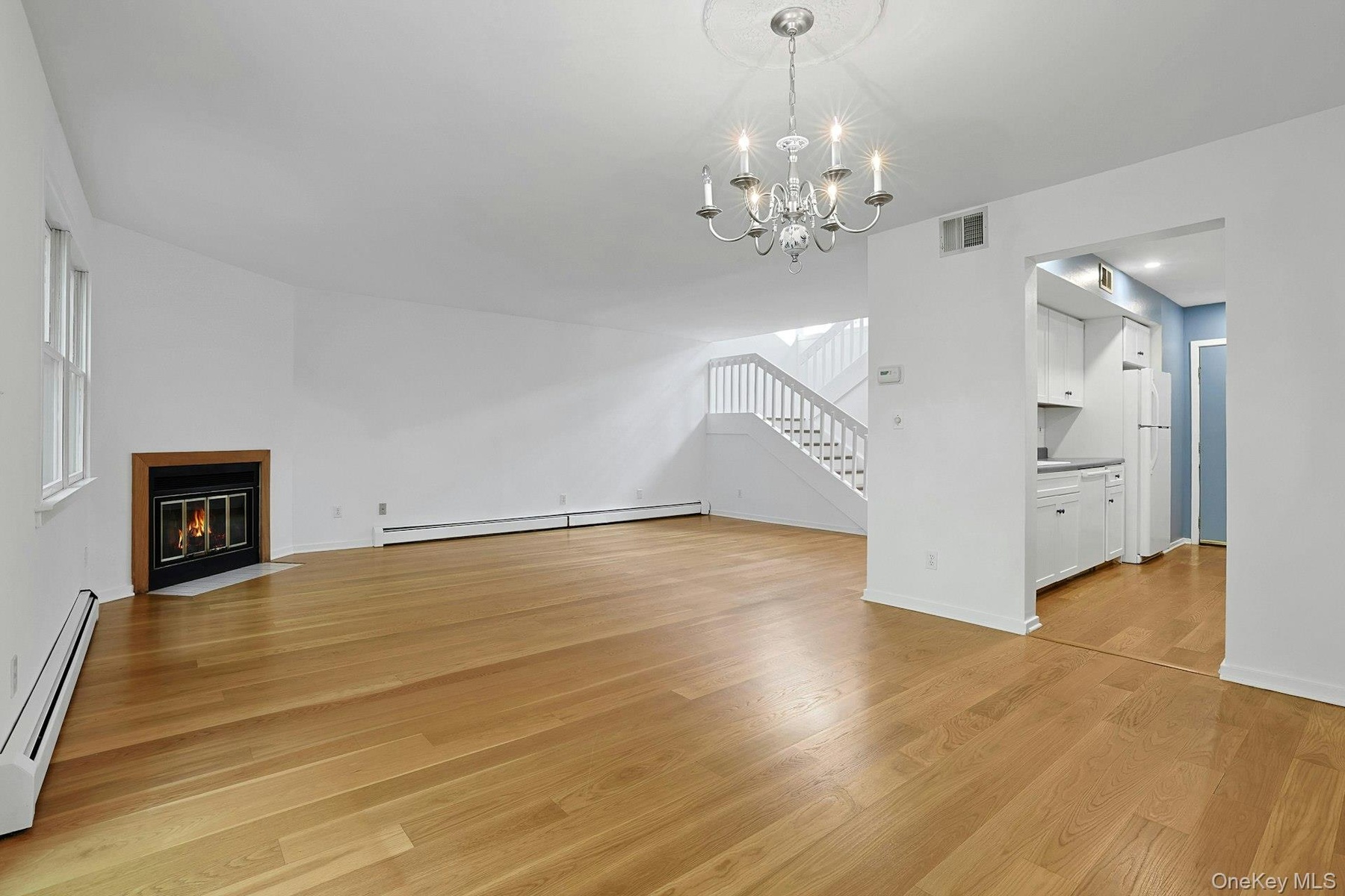 Heading from the dining room to the kitchen, we can see the easy flow between the spaces in this home.