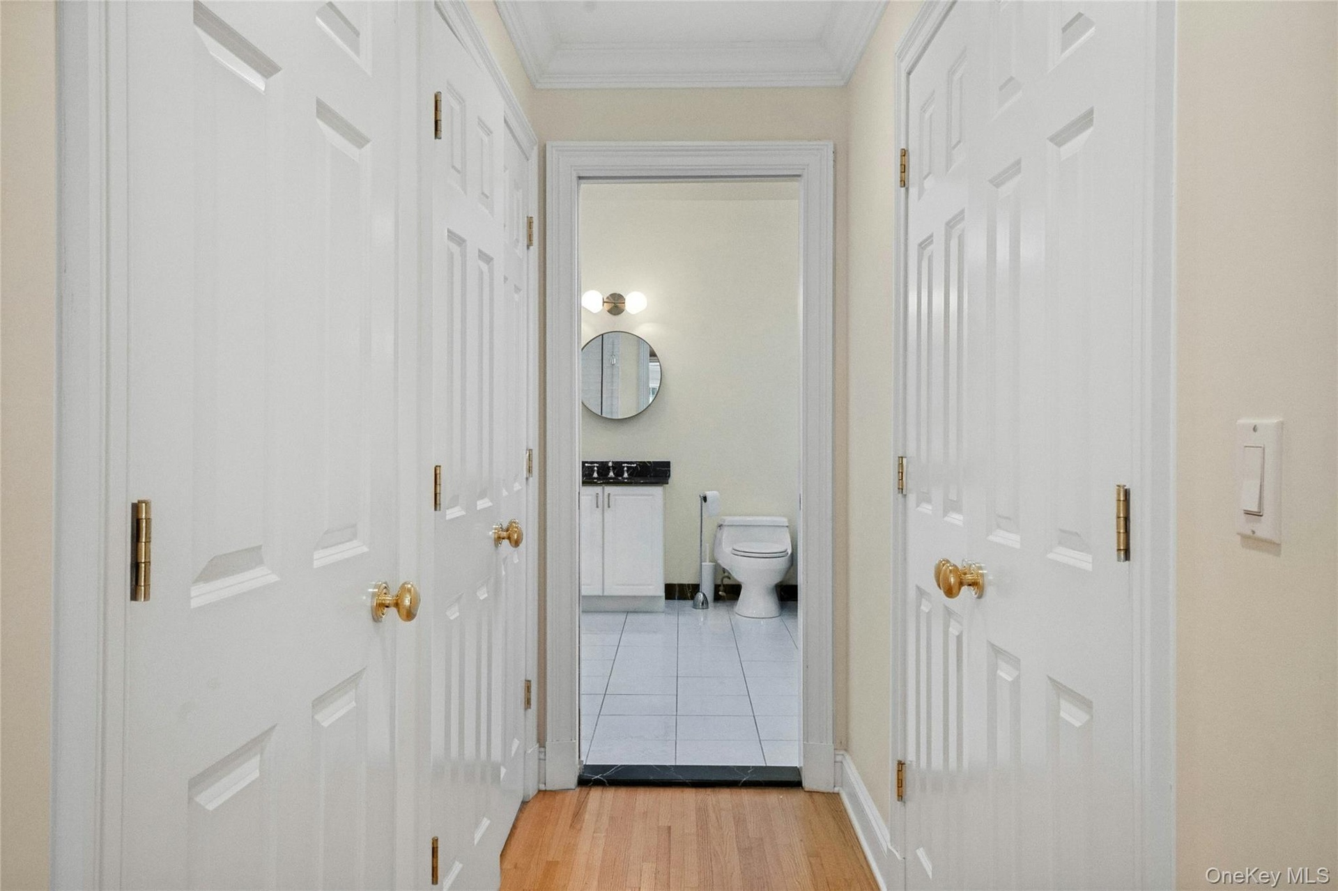 Walk in closets to the right and left as you walk toward the primary bathroom