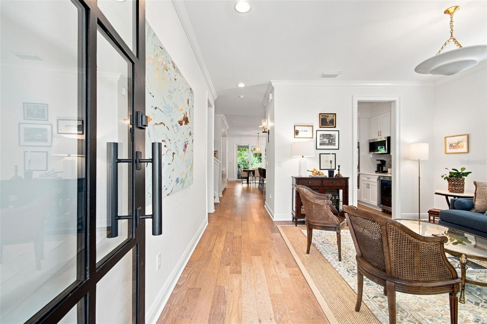 Custom glass front door provides a light filled entry.