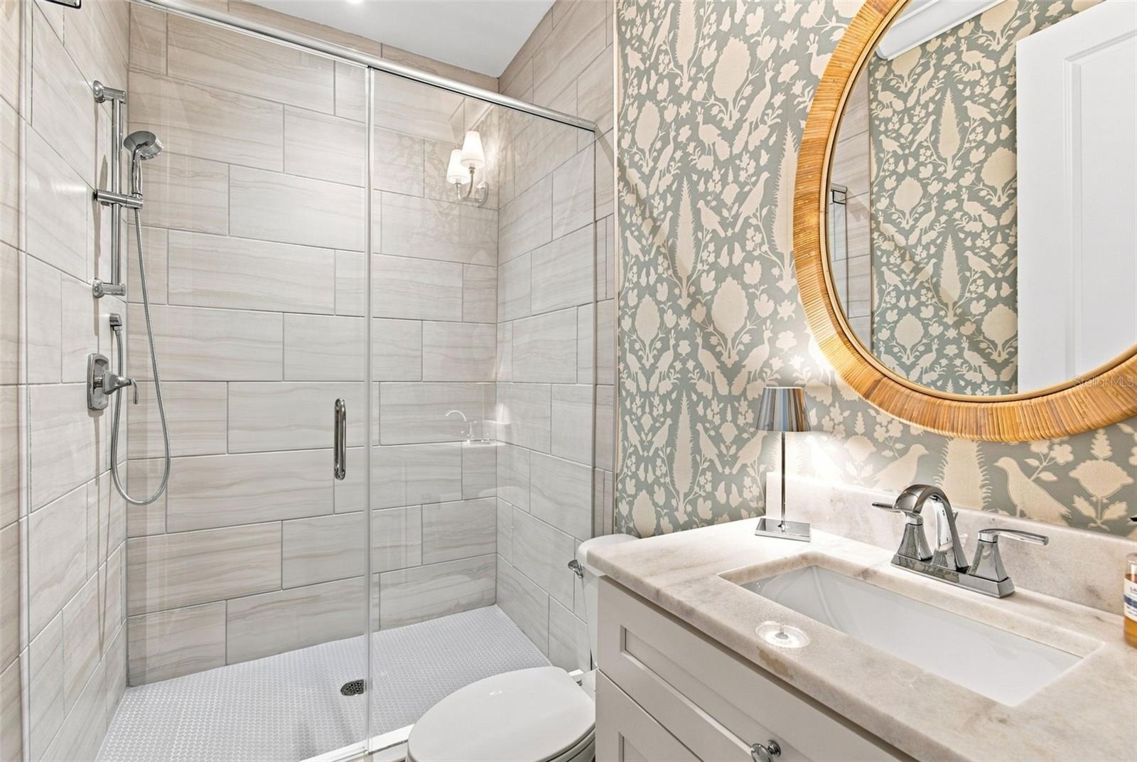 Full downstairs bathroom that services guests and the downstairs bedroom.