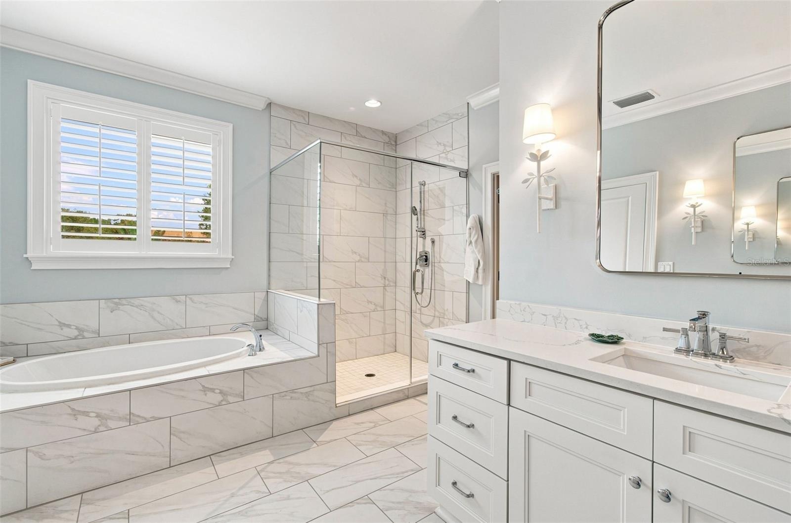 Spacious bath offers separate tub and shower.