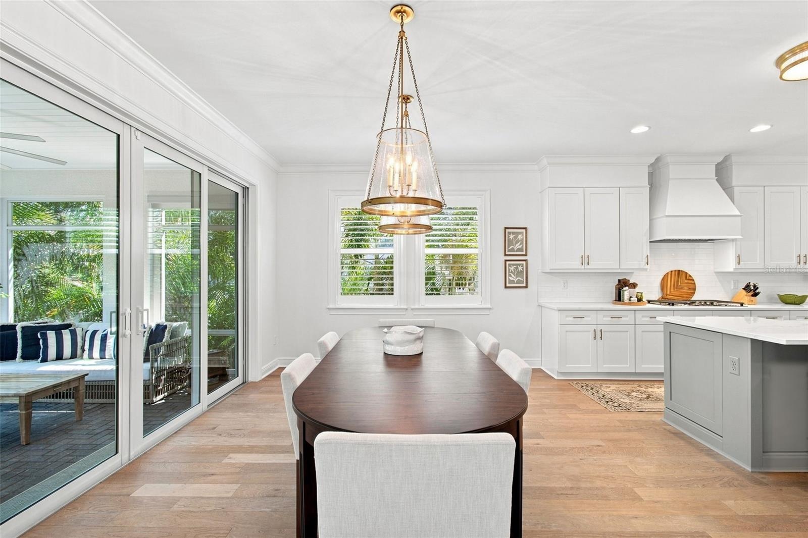 Dining area opens onto screen porch.