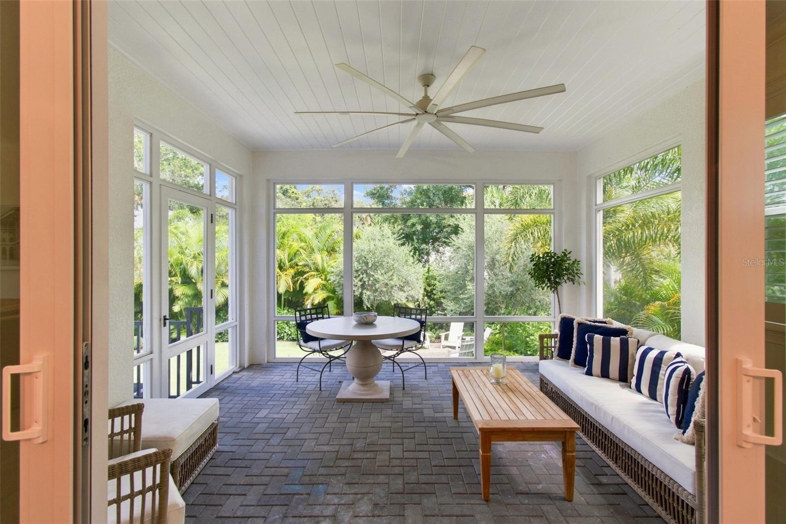 Tongue and grove ceiling and wood details add character to the screened porch.