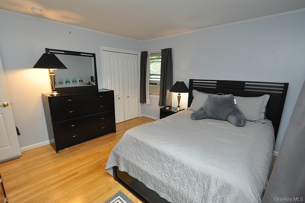 ThirdThird Bedroom has hardwood floors and is approx 12'-11" x 12'-6" Bedroom