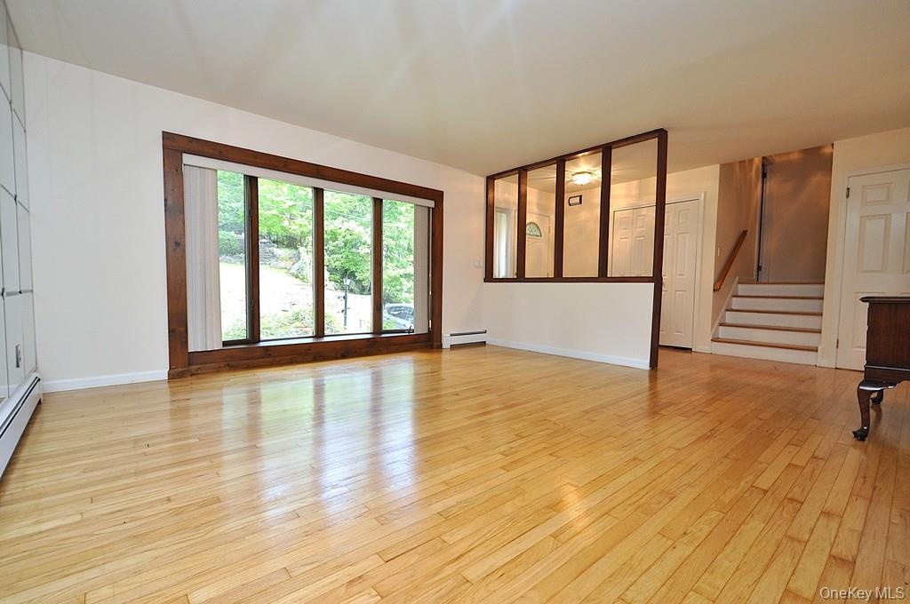 Living Room has a bay window, hardwood floors and opens to the dining room. Living room is approx 16'-6" x 14'-11"
