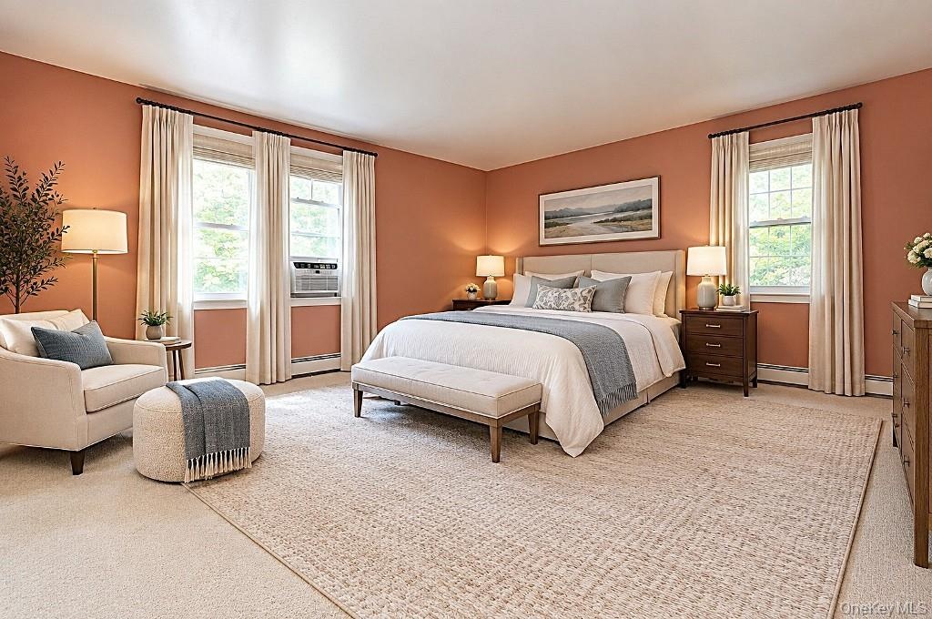 Photo Visually Staged.  Large Primary Bedroom has wall to wall carpeting, two large closet and a private bath.  The room is approx. 16'-6" x 16'-2".