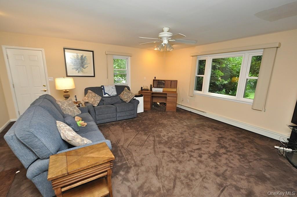 Lower Level recreation room has a fireplace, access to the outside, garage and utility room and storage.  The room is approx. 19'-4" x 18'-6".
