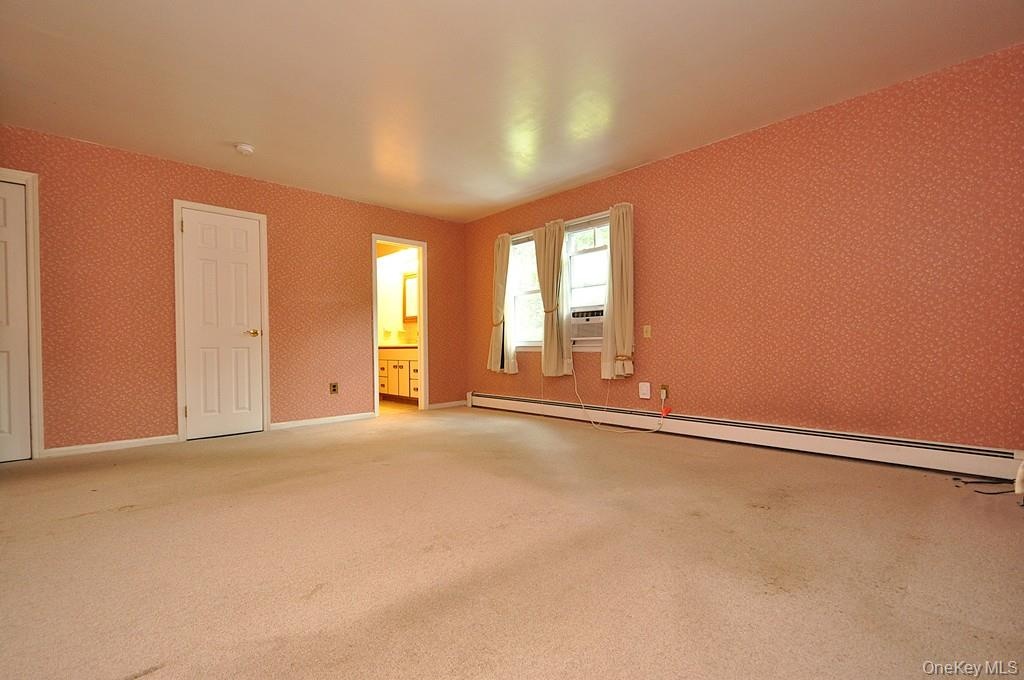 Large Primary Bedroom has wall to wall carpeting, two large closet and a private bath.  The room is approx. 16'-6" x 16'-2".