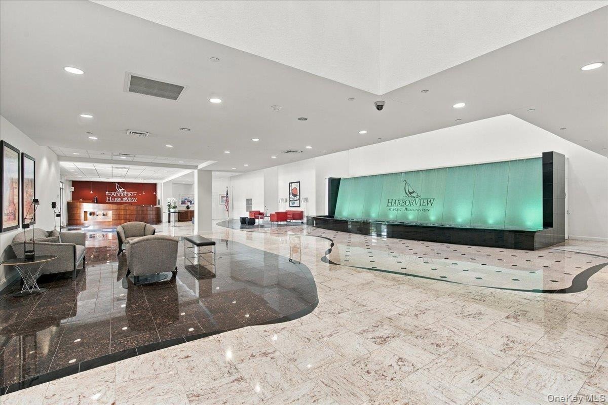 Entrance Foyer with waterfall and marble floors