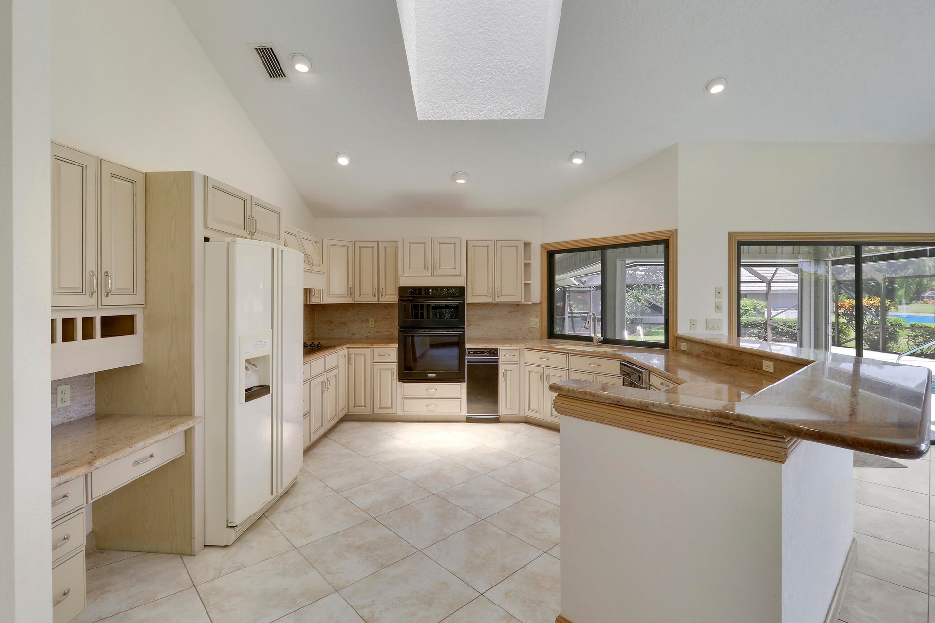 Spacious kitchen with skylight.