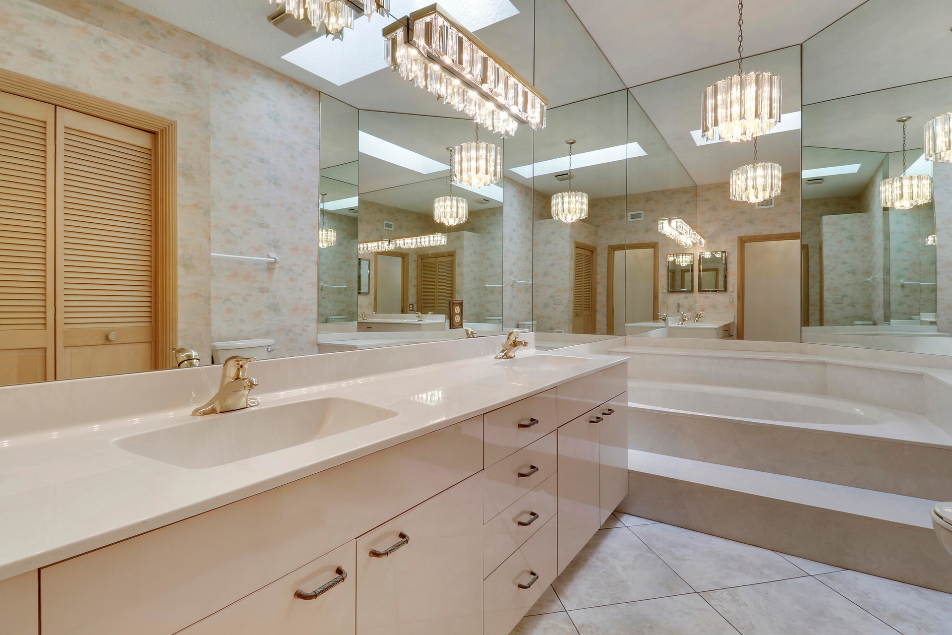Large Guest bath with dual vanity and soaking tub.