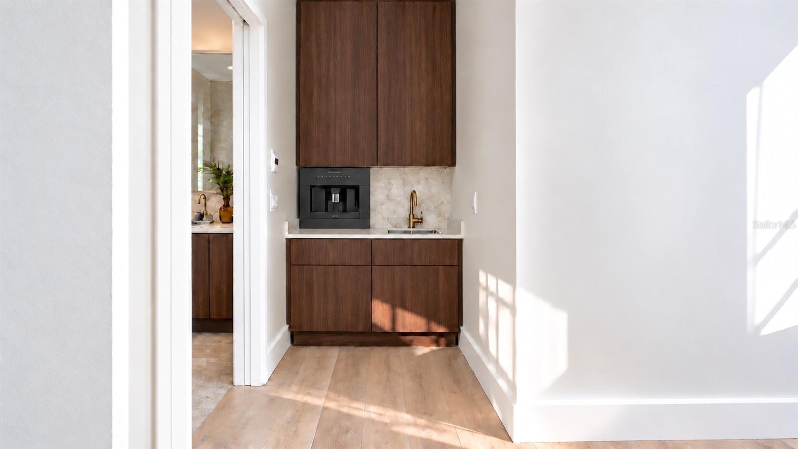 Wet bar for the primary bedroom, with virtual staging