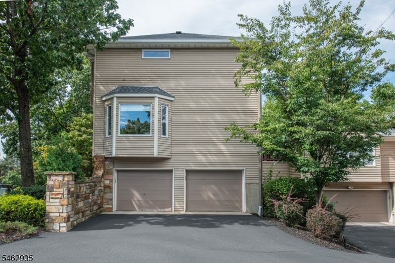 Side view w/ 2 car garage