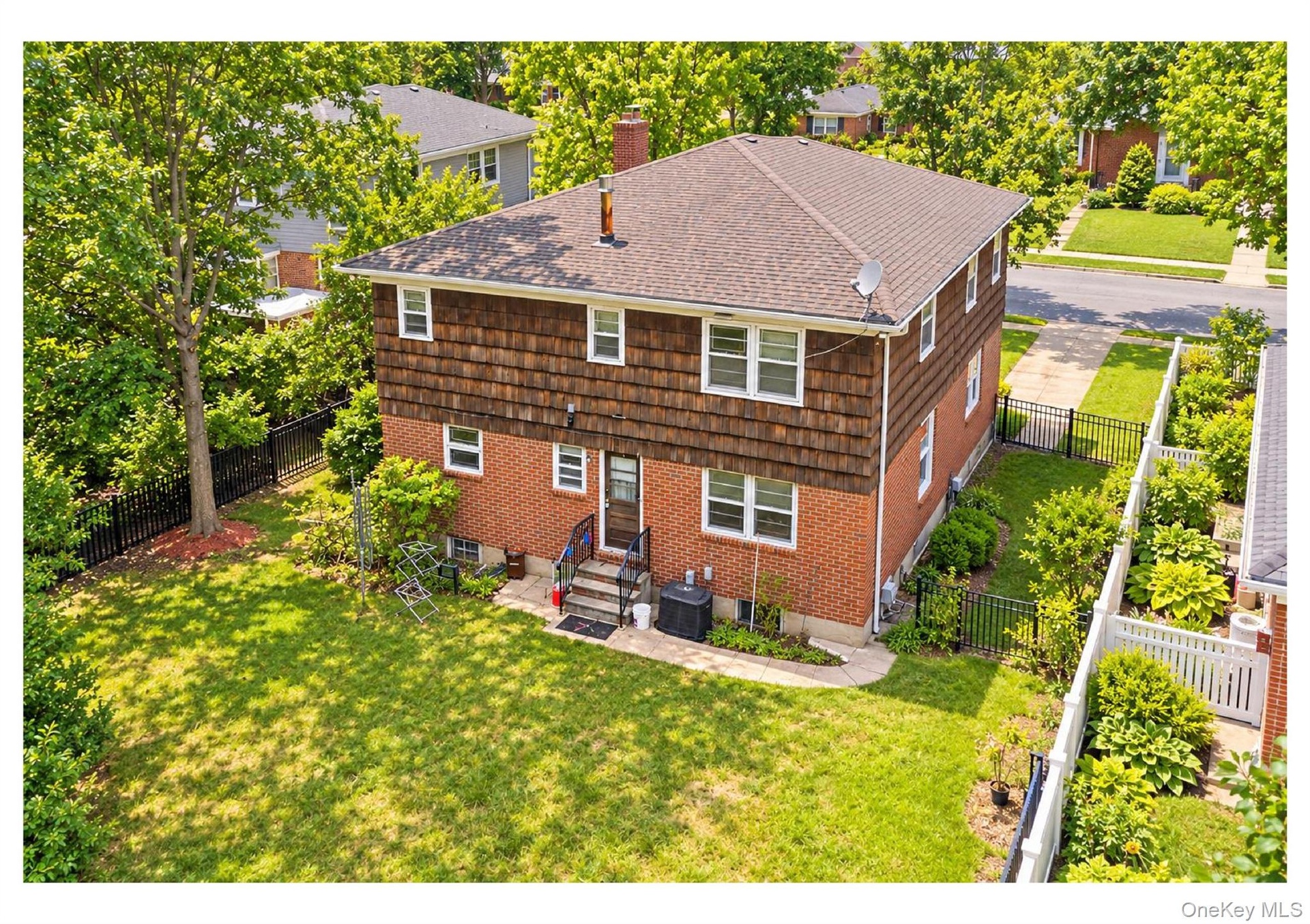 Brick and shingle exterior with a gabled roof