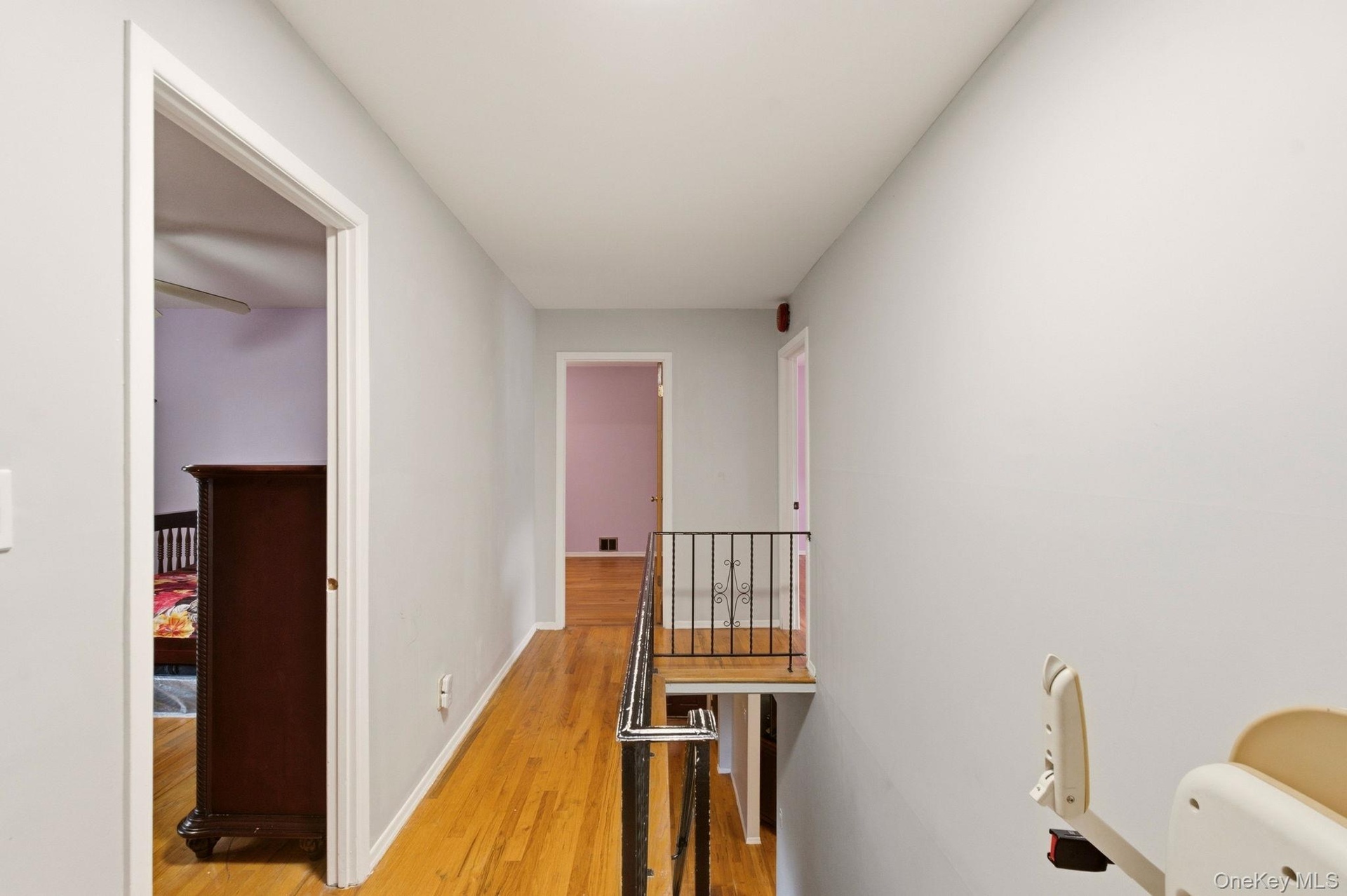 Hardwood flooring throughout the hallway