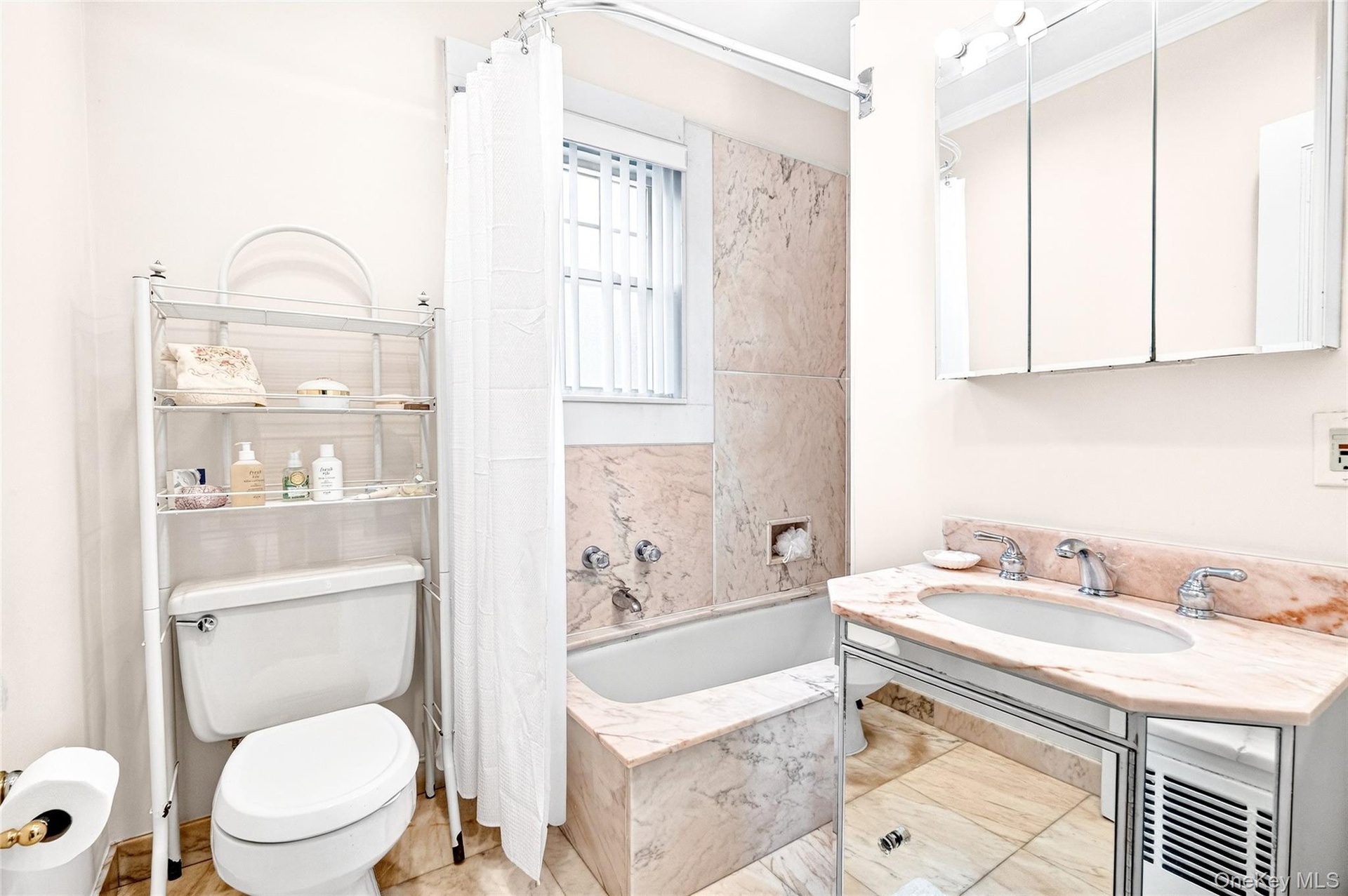 Full bathroom with a sink and a combined bath / shower with marble appearance
