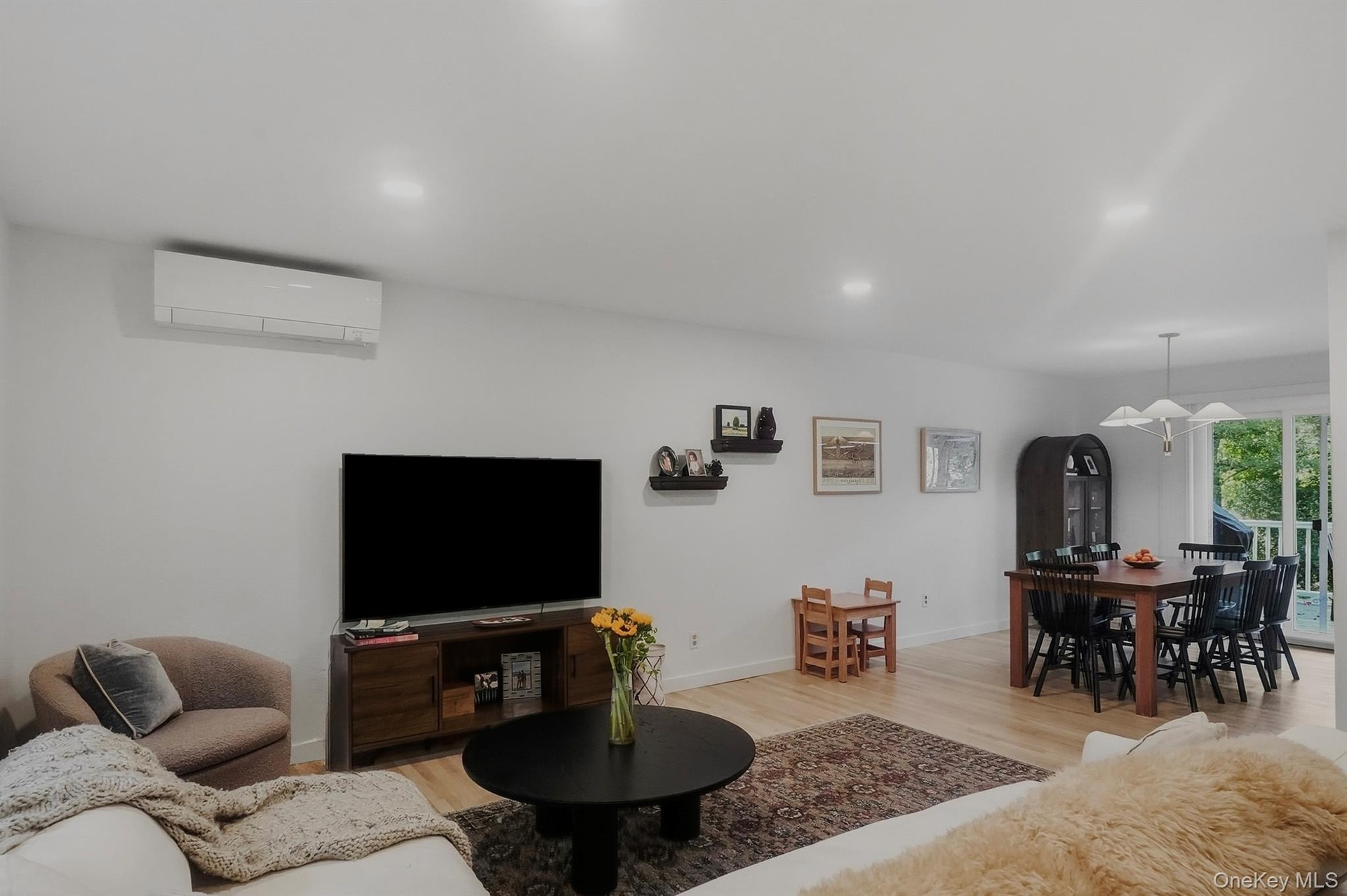 Family room with access to dining area and sliding doors to porch