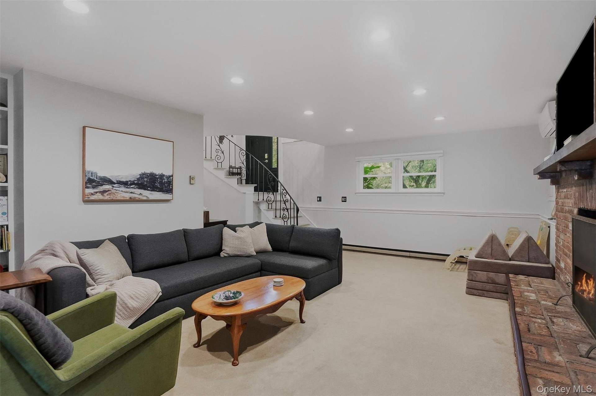 Den with access to laundry, sun room and pool