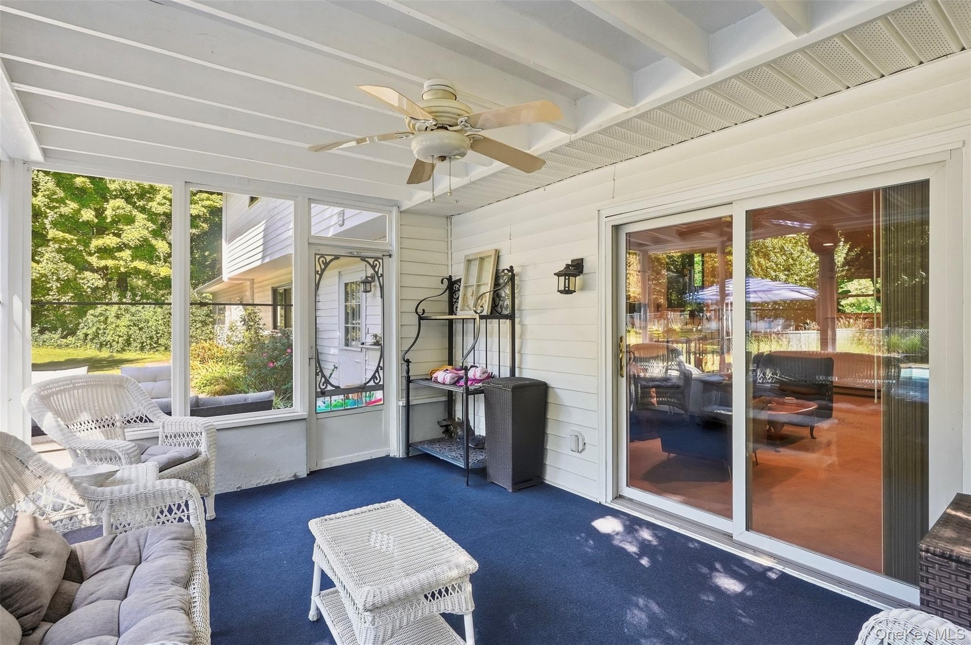 Sunroom with access to den and pool