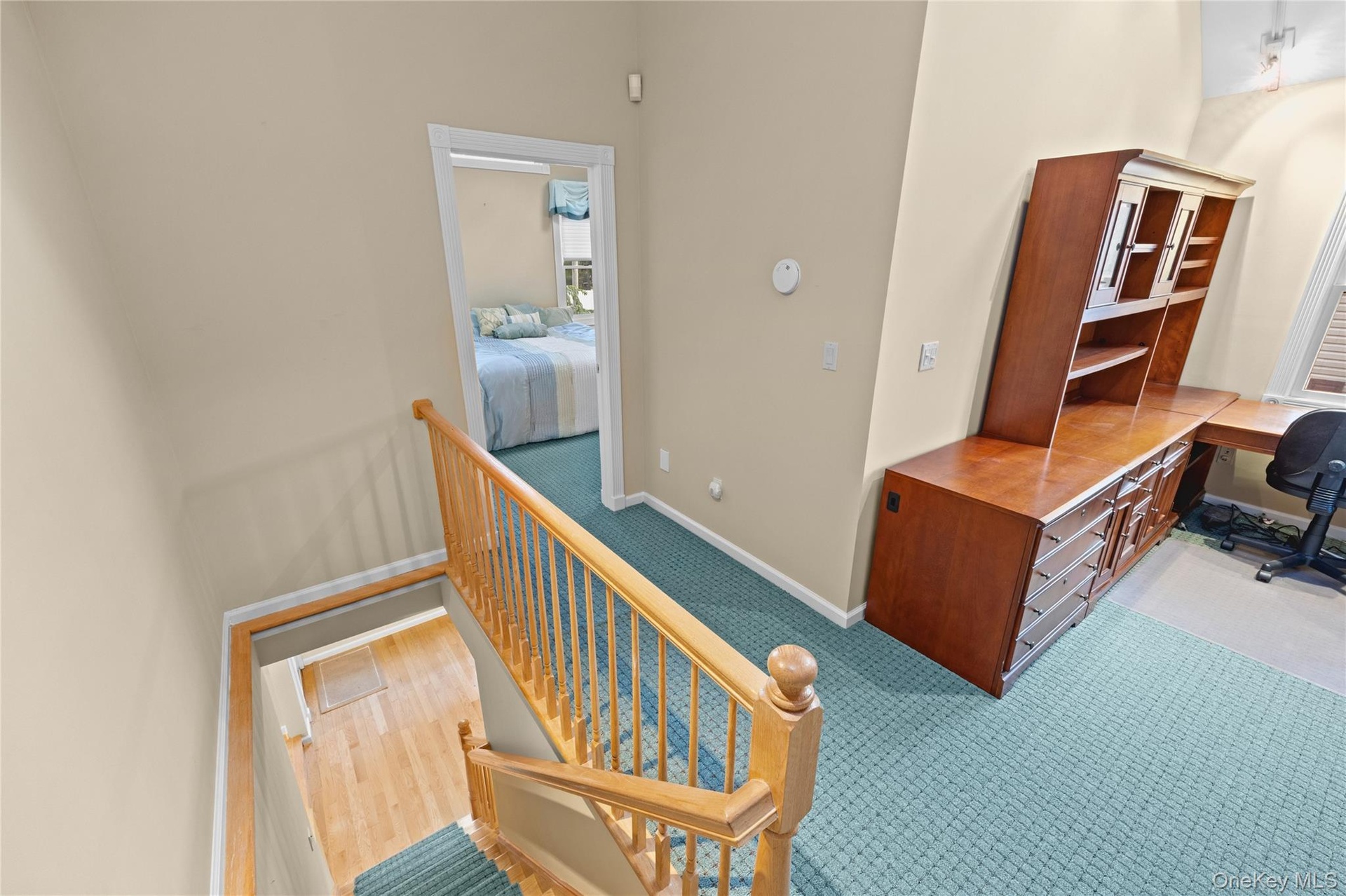 Staircase with wood banister and balusters