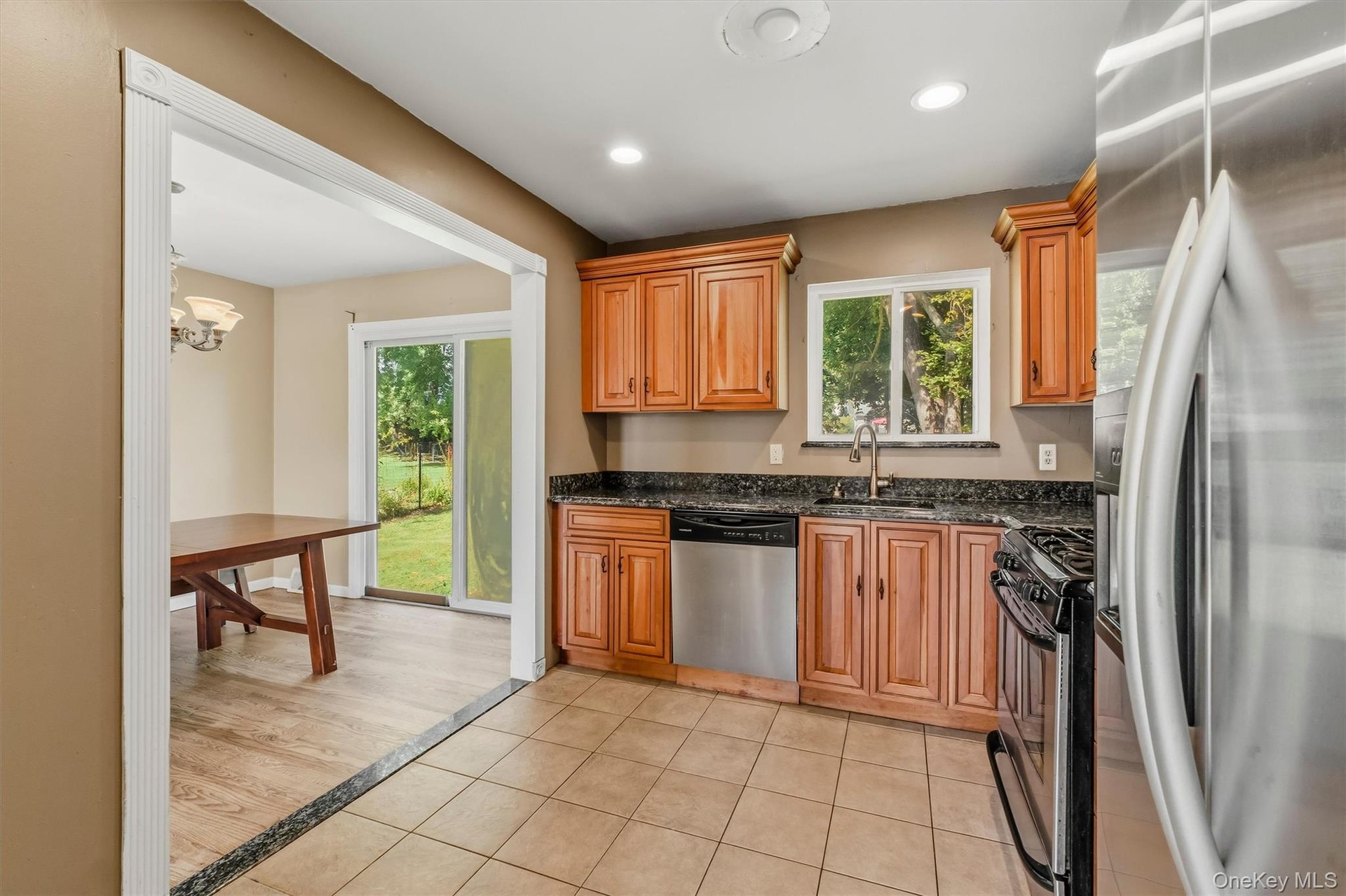The kitchen is accented with tile flooring and granite countertops.