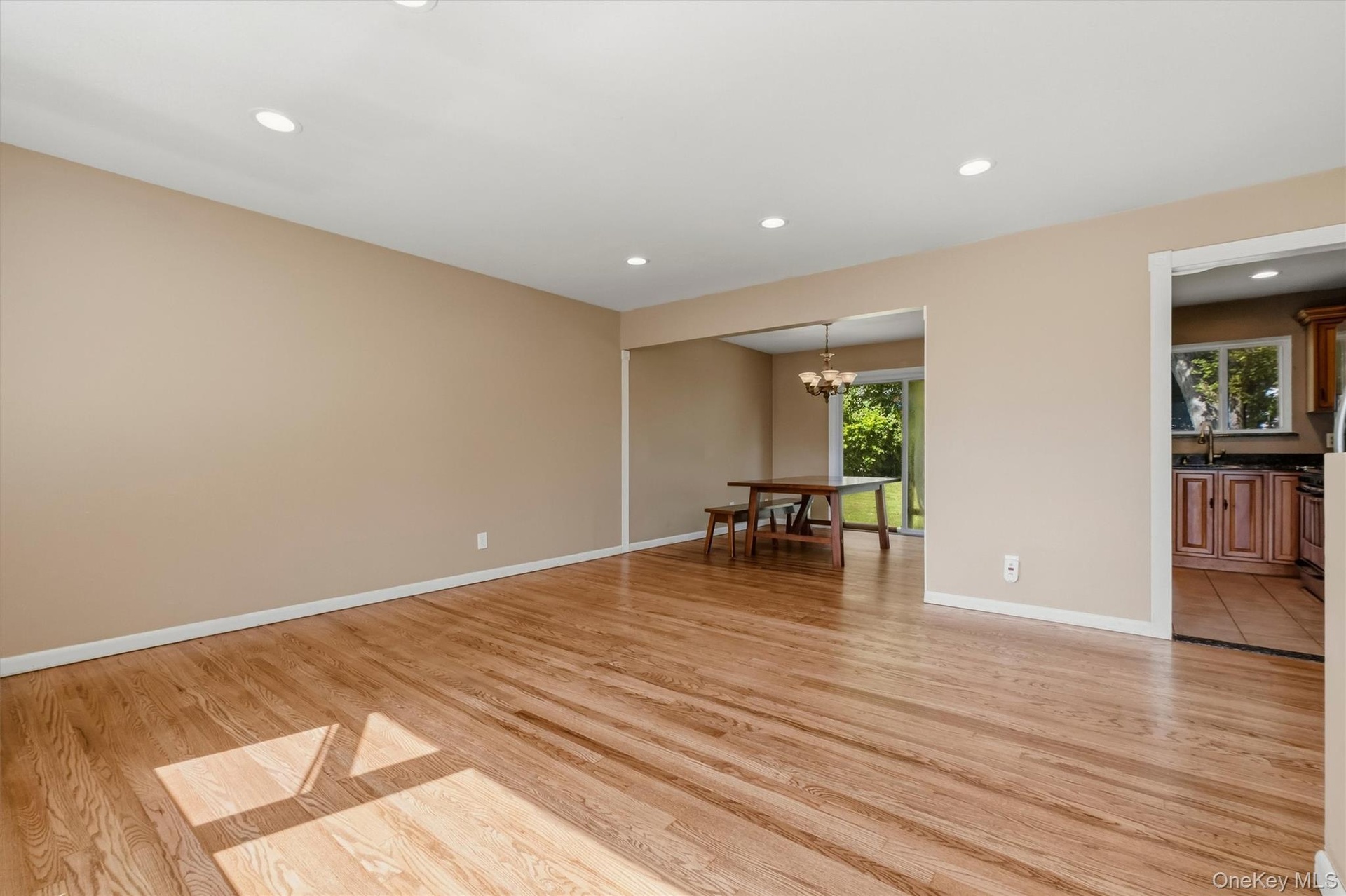 The spacious living room opens to the formal dining room.
