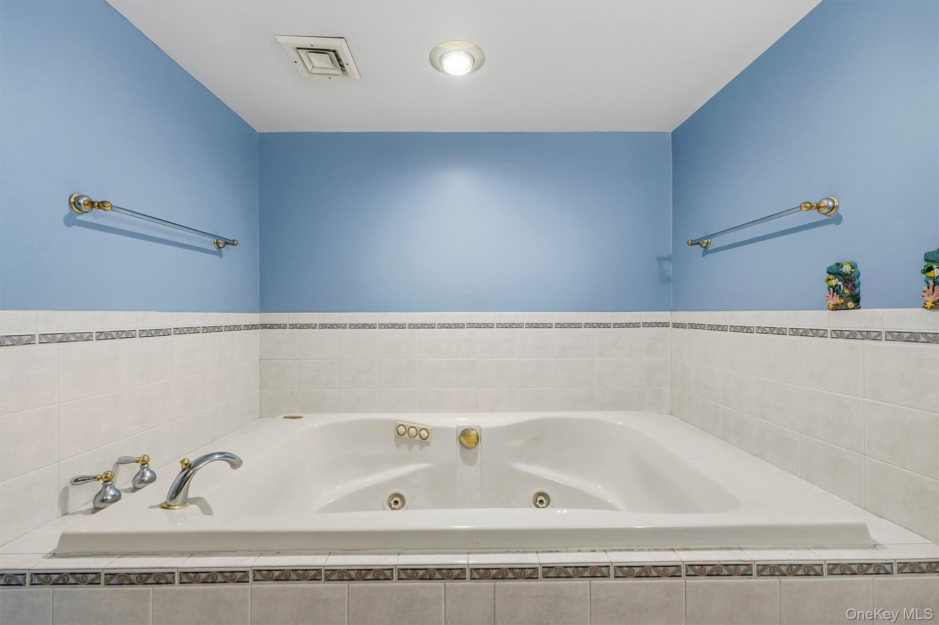 Large bathroom on lower lever with large tub.