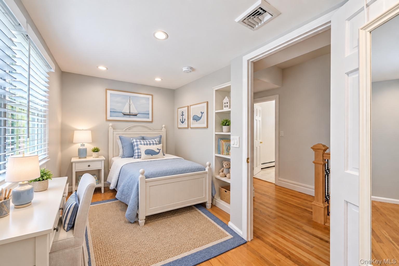 bonus room ideas Recessed lighting illuminates this room featuring wood-finish flooring