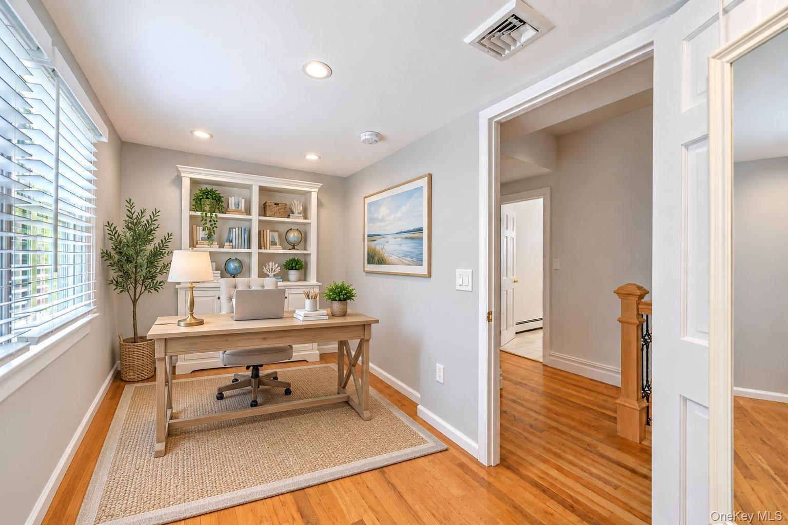 bonus room ideas great for office Recessed lighting, wood-finish flooring, white built-in shelving, and a window with blinds