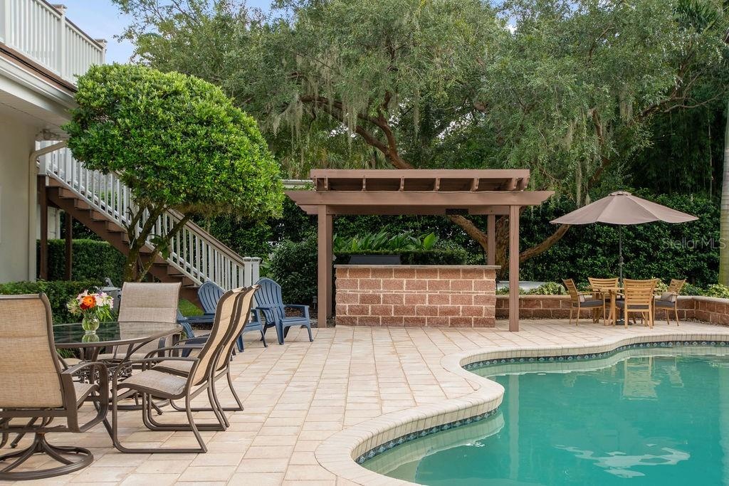Exterior staircase leading to pool deck.