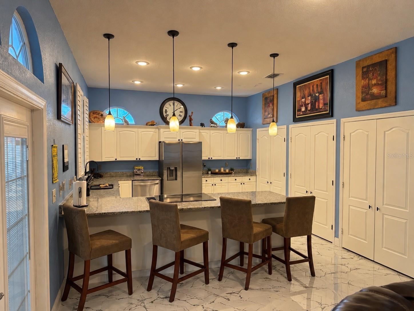Counter eating space in kitchen. Stainless steel appliances