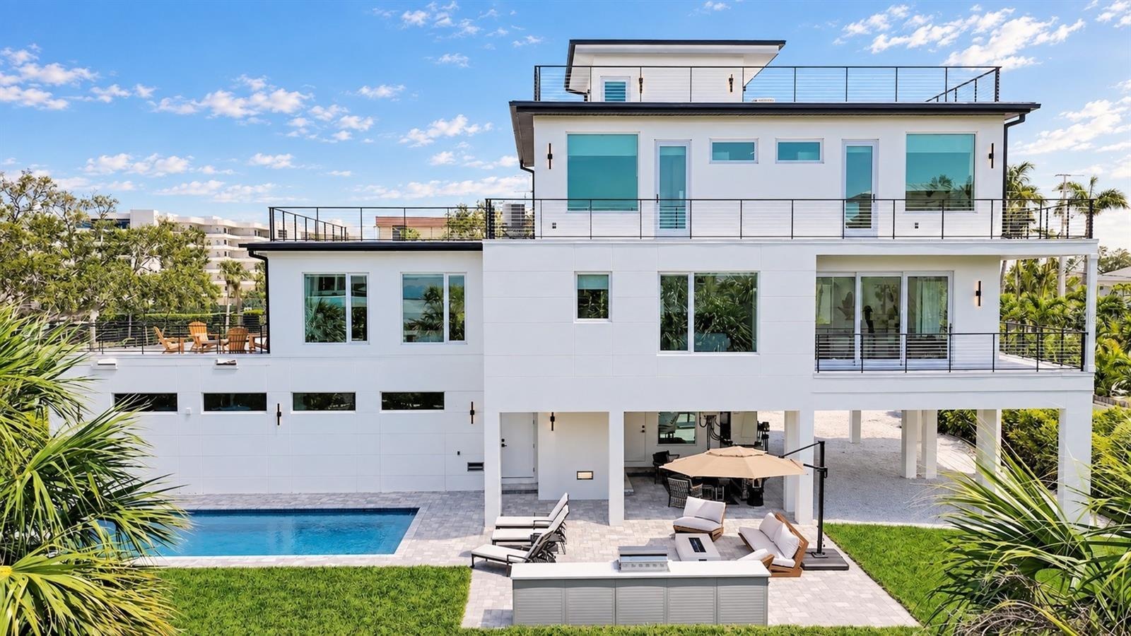 Full outdoor kitchen and heated salt water pool with hot tub spa