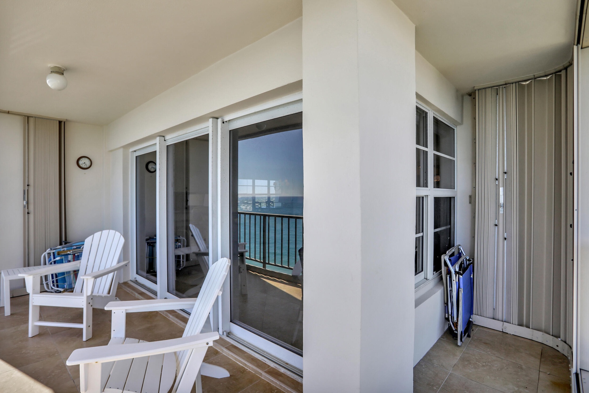 Wrap around NE corner with hurricane shutters to protect patio furniture.