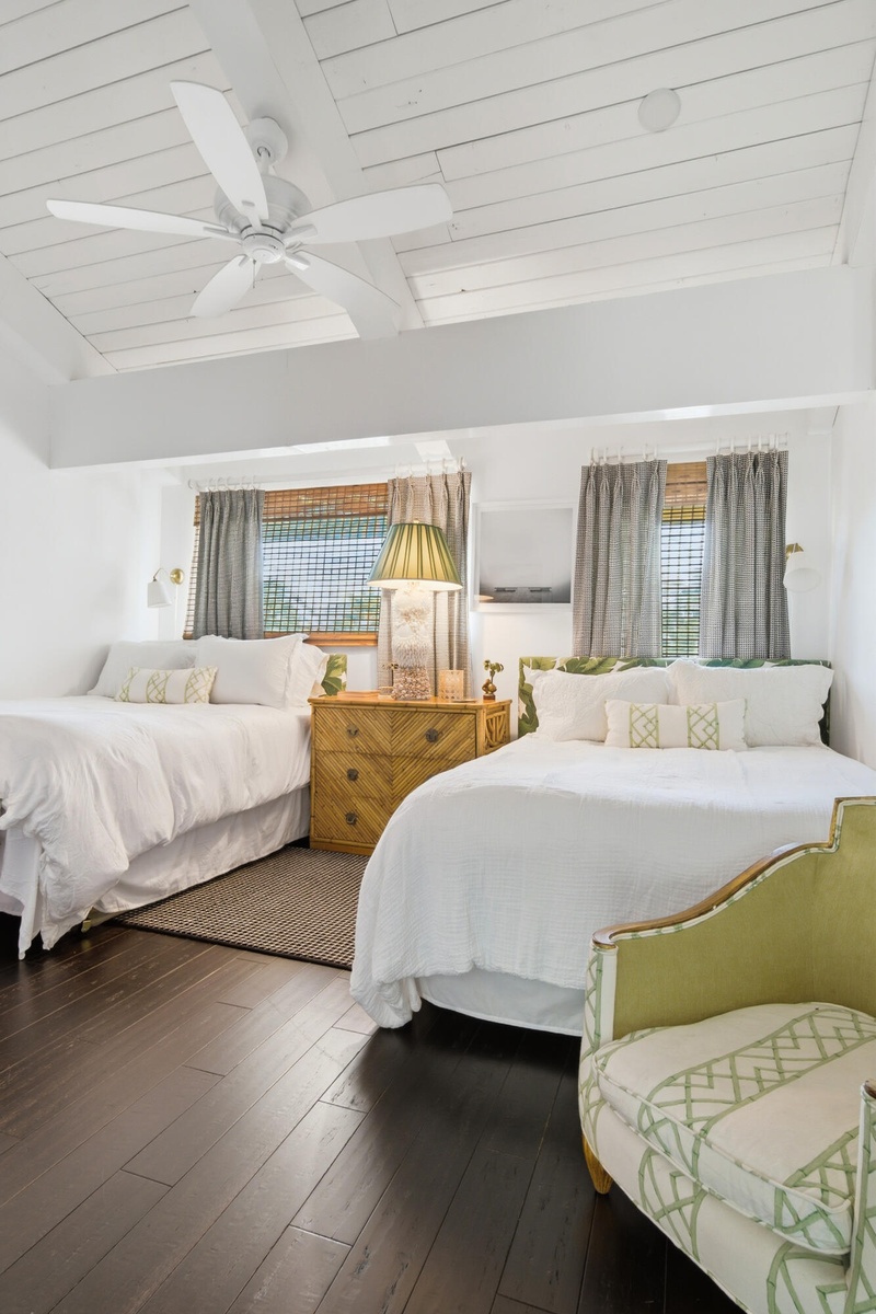 Vaulted wood-plank ceiling, exposed beams, dark wood-finish flooring, recessed lighting, and a ceiling fan