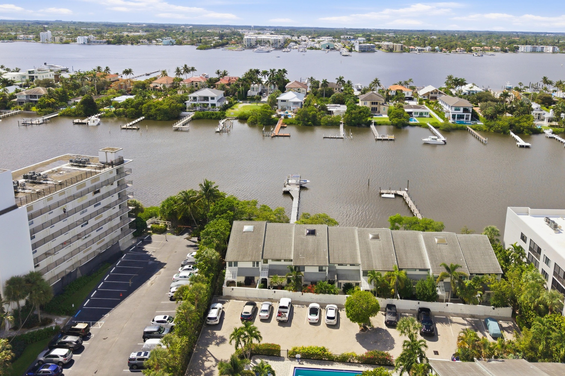Waterfront property featuring private docks and mature landscaping
