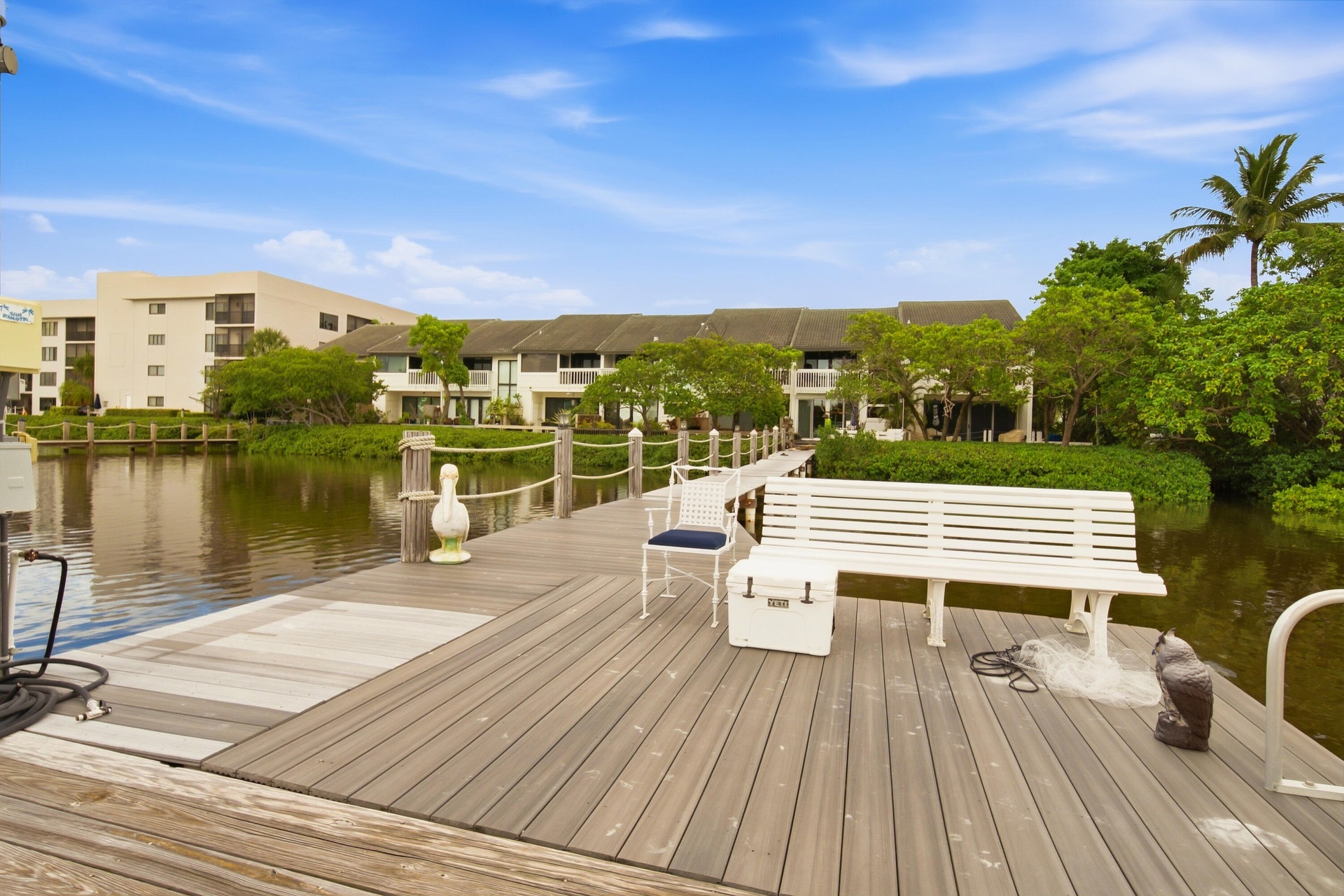 Composite wood dock with rope railings and a dedicated boat slip