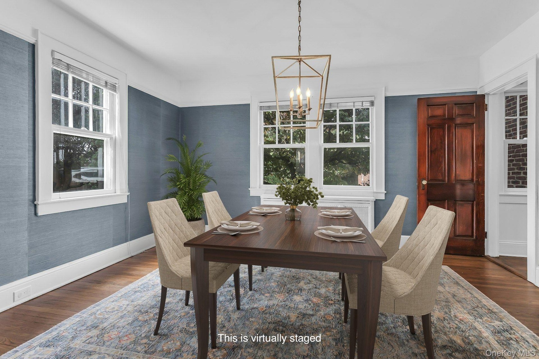 Furniture is virtually staged in the dining room