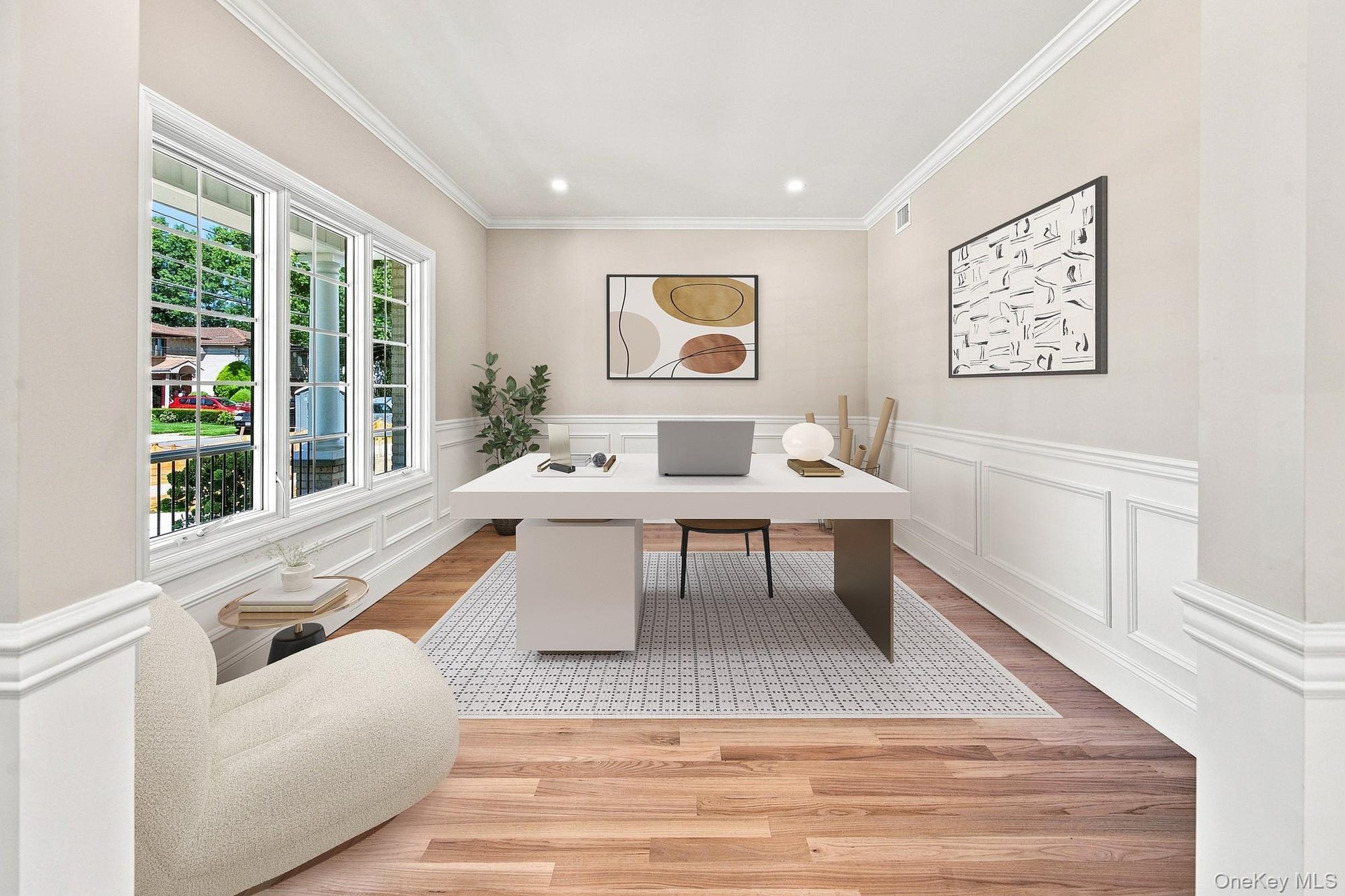 Flexible space: office, study, den, playroom. Wood-finish flooring, white paneled wainscoting, crown molding, recessed lighting, and multiple windows 