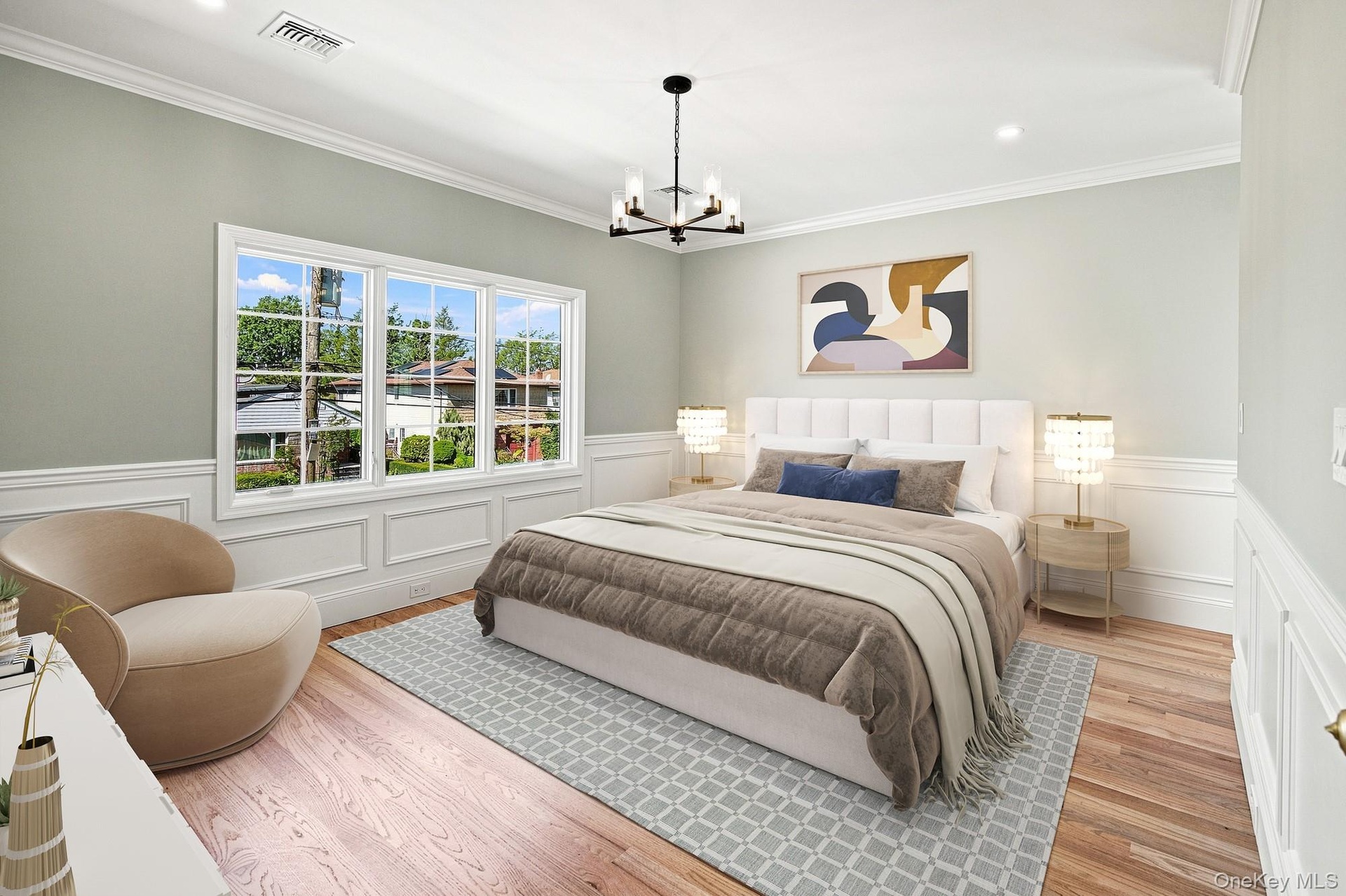 Primary Bedroom with hardwood flooring, crown molding, wainscoting, recessed lighting.VIRTUAL STAGING