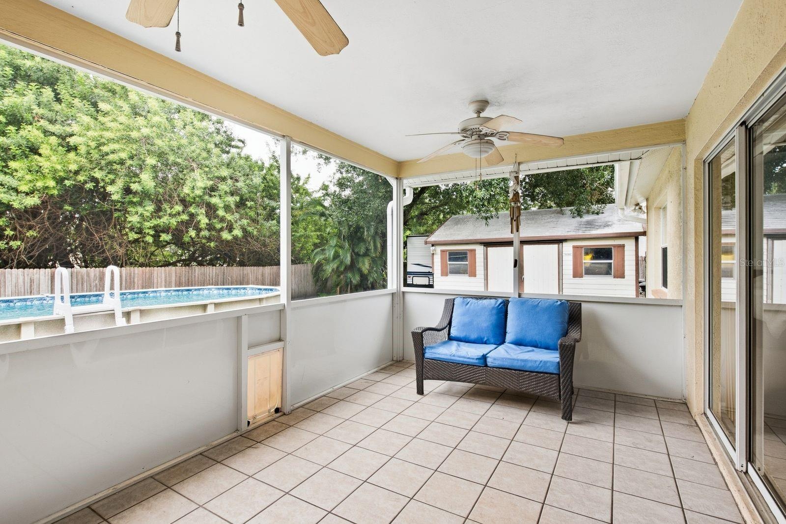 Back patio, leading to pool and backyard