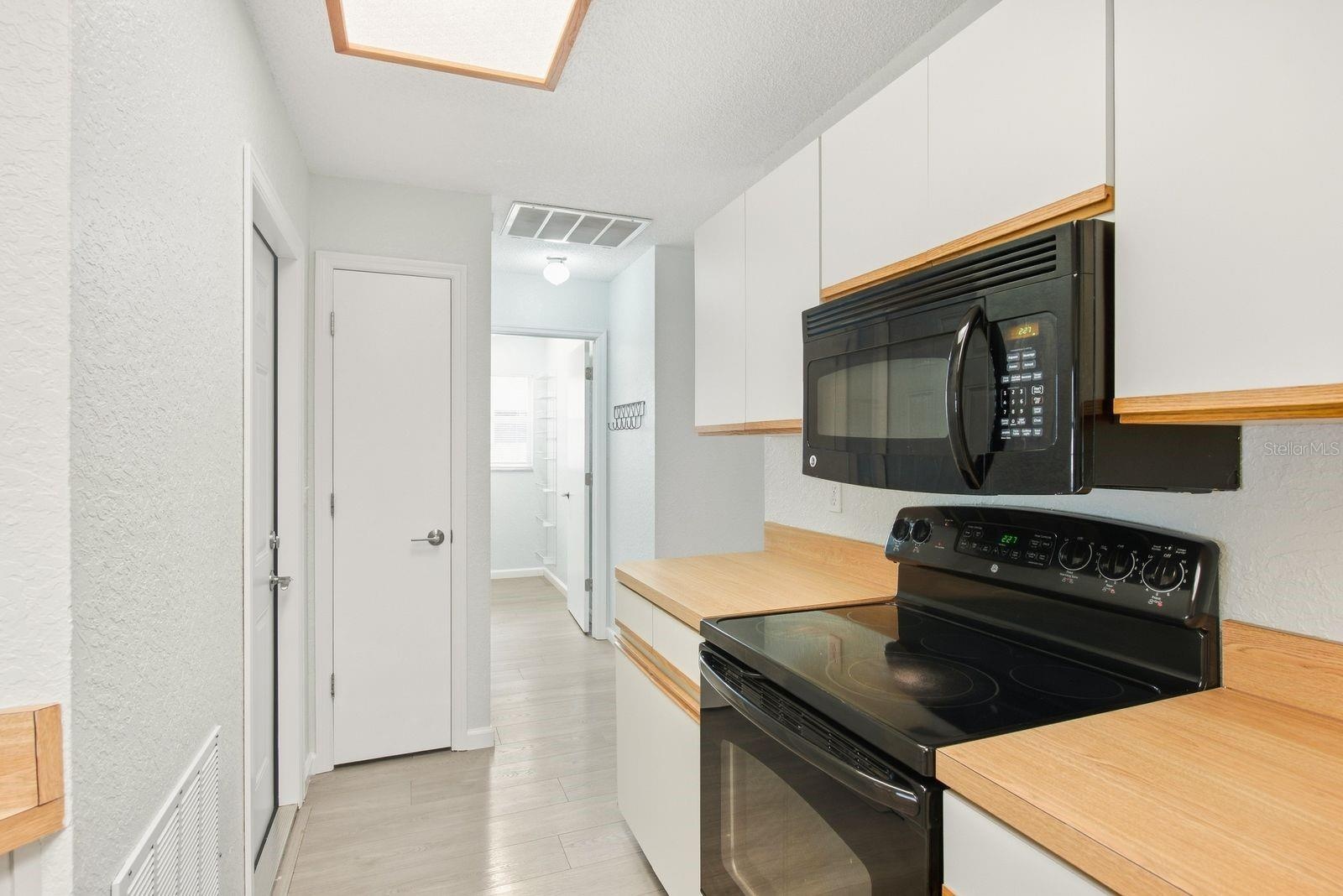 A spacious kitchen layout with generous counter space.