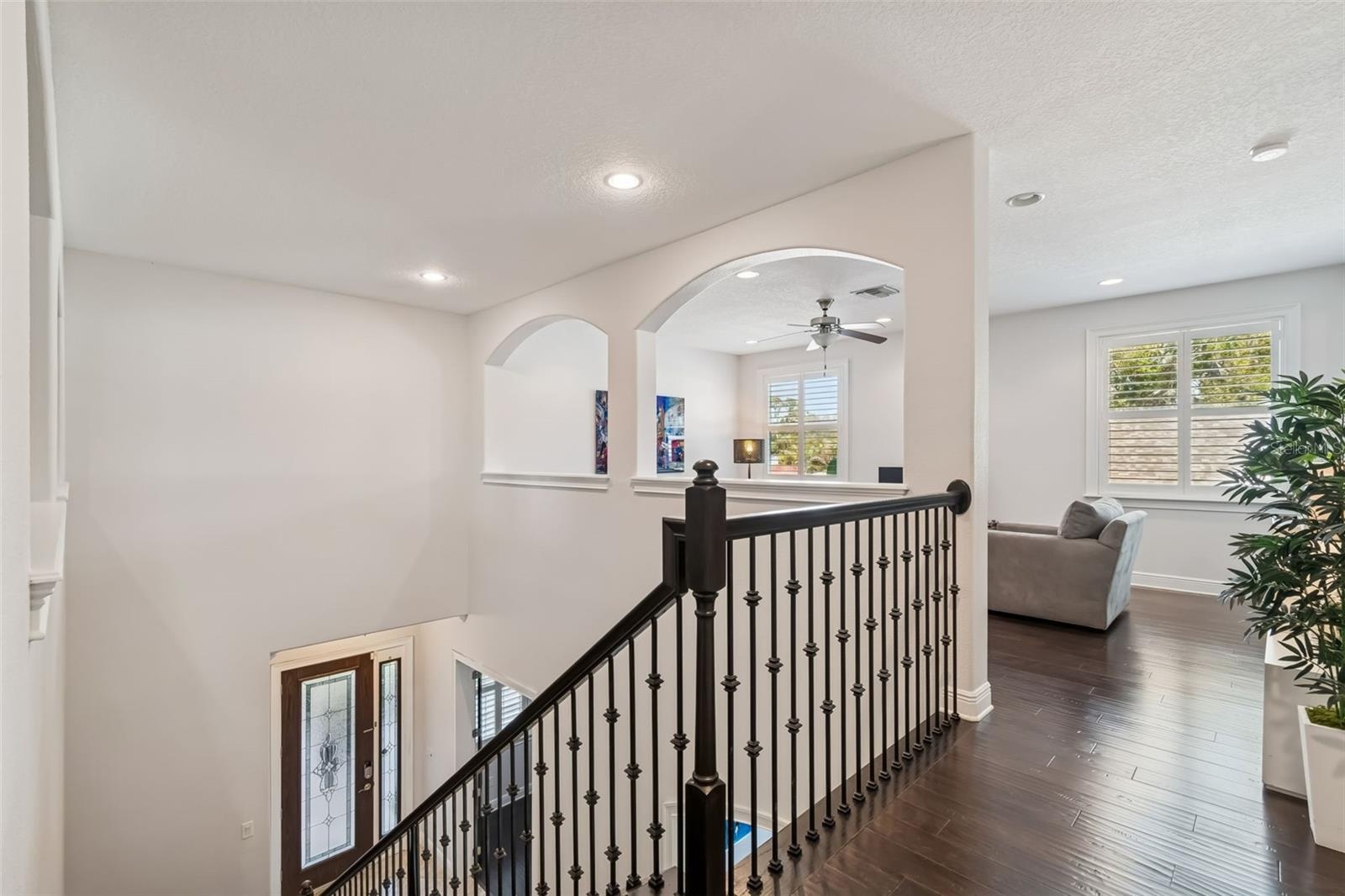 A second view of the upper hallway and open foyer.