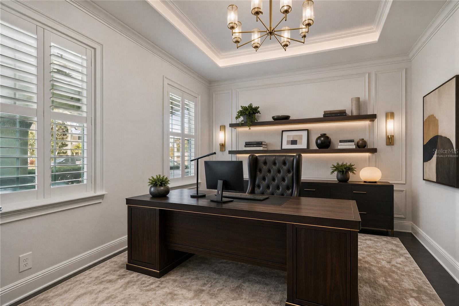 Virtually staged office space illustrating one way to furnish the space.