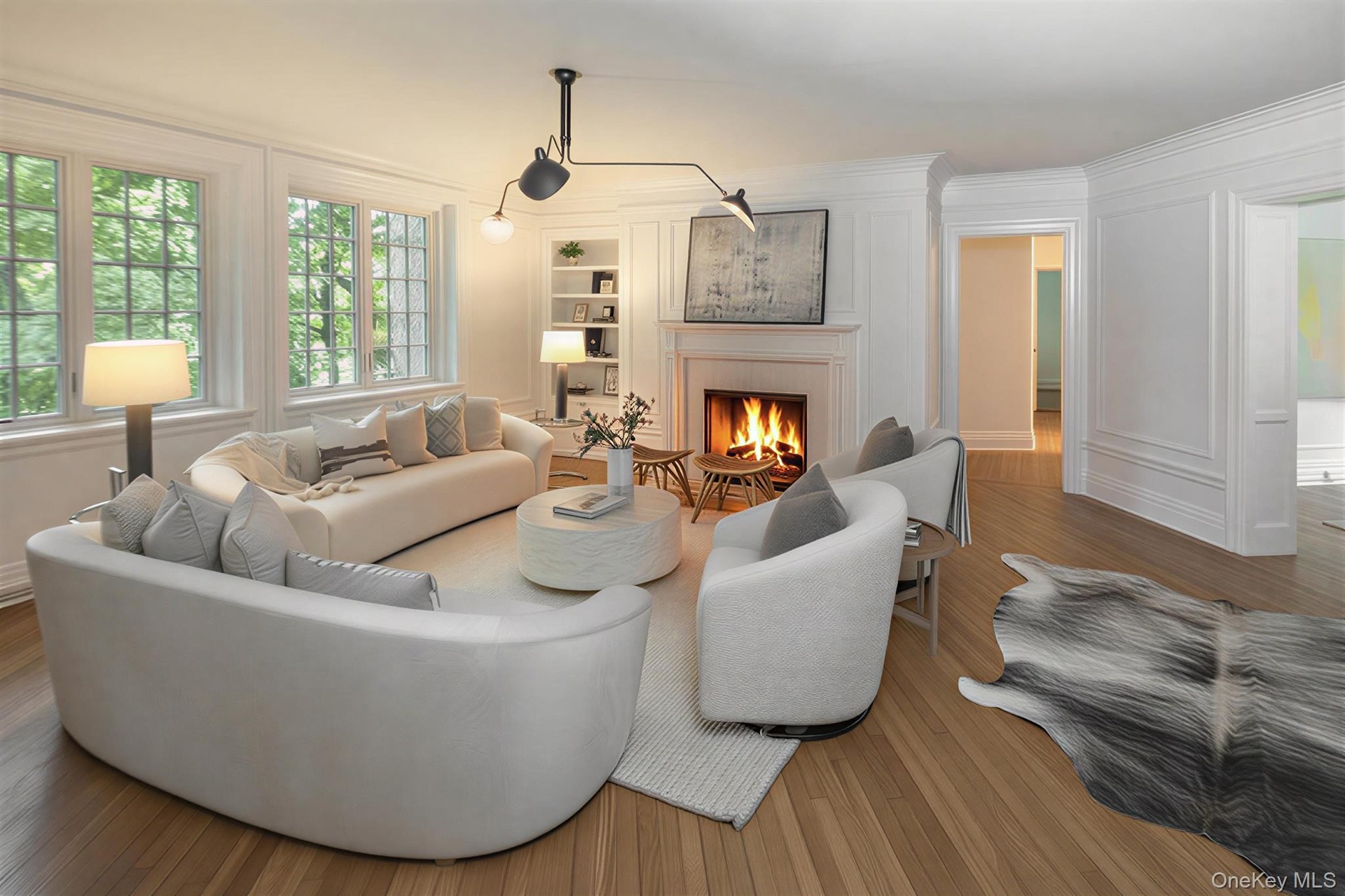 Spacious Living room with fireplace offers  lovely views of the Bronxville Lake through new divided light windows