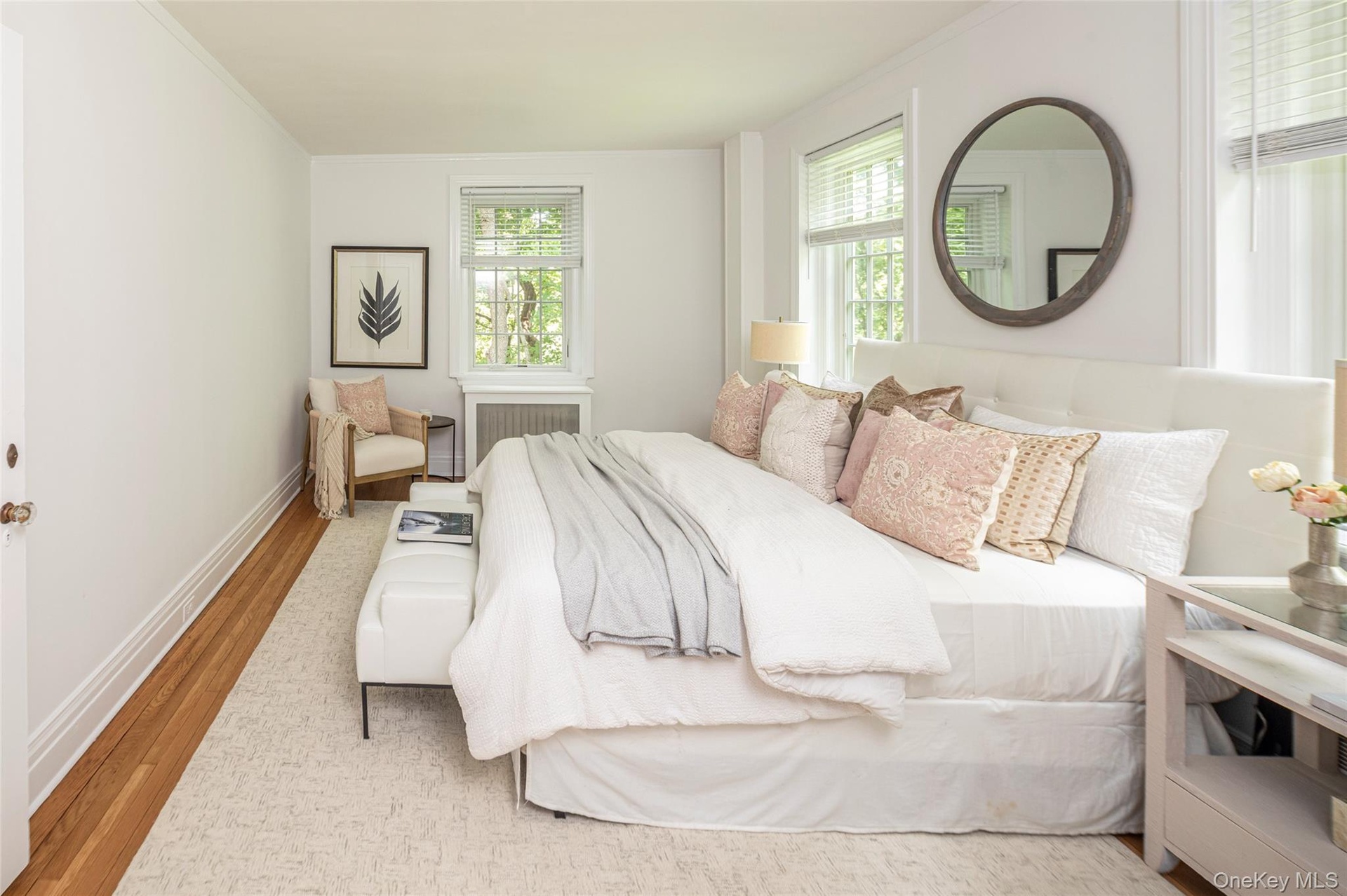 Large primary bedroom with lake views